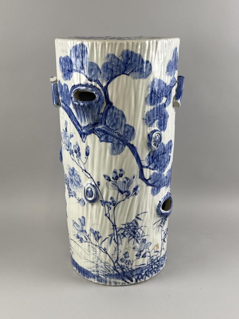 JAPANESE PORCELAIN GARDEN STOOL 20th Century Height 21.5".: JAPANESE PORCELAIN GARDEN STOOL 20th Century Formed as a tree stump, with blue and white decoration of floral sprays. Height 21.5".