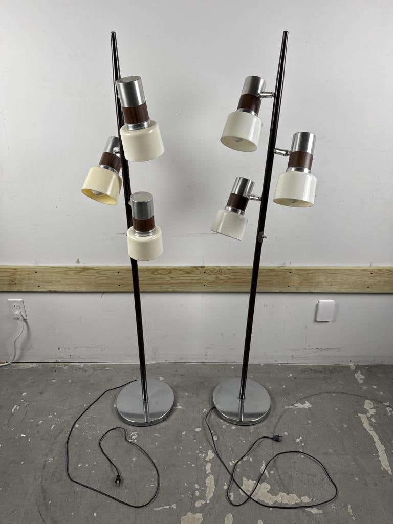 NEAR-PAIR OF MID-CENTURY MODERN ADJUSTABLE FLOOR LAMPS ATTRIBUTED TO GERALD THURSTON 20th Century: NEAR-PAIR OF MID-CENTURY MODERN ADJUSTABLE FLOOR LAMPS ATTRIBUTED TO GERALD THURSTON 20th Century One with white shades, other with cream, but otherwise identical. Heights 61". Base diameters 11".