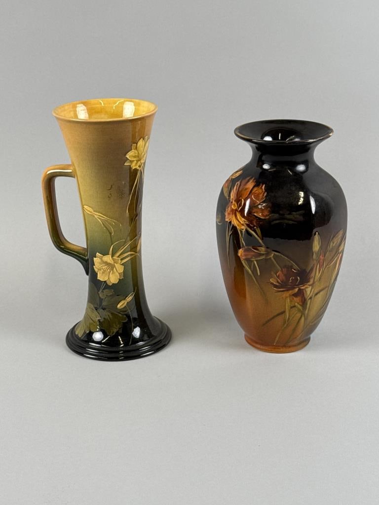 TWO PIECES OF ROOKWOOD POTTERY Cincinnati, Late 19th Century: TWO PIECES OF ROOKWOOD POTTERY Cincinnati, Late 19th Century Both with maker's mark on underside. 1) Albert Valentien for Rookwood handled vase with columbine decoration. Marked "AV" on underside. Hei