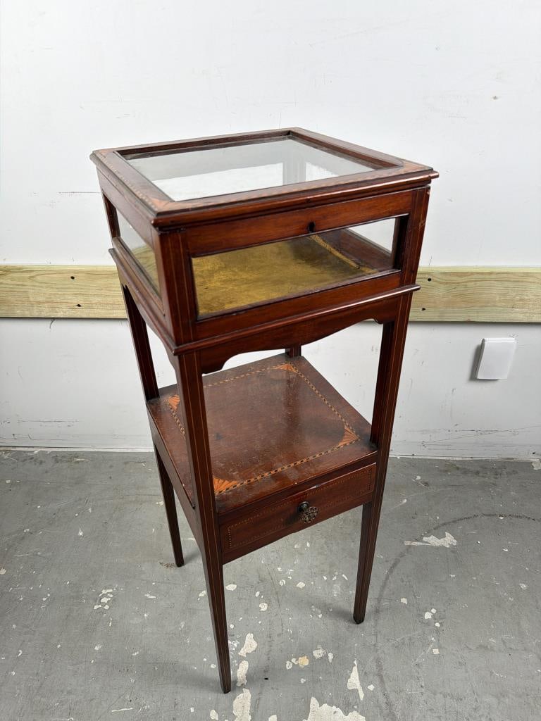 INLAID MAHOGANY VITRINE Late 19th Century Height 37.25". Width 13.5". Depth 13.5".: INLAID MAHOGANY VITRINE Late 19th Century Hinged locking lid, no key. Tapered square legs with line inlay. Low drawer with geometric inlay on the drawer front. Height 37.25". Width 13.5". Depth 13.5".