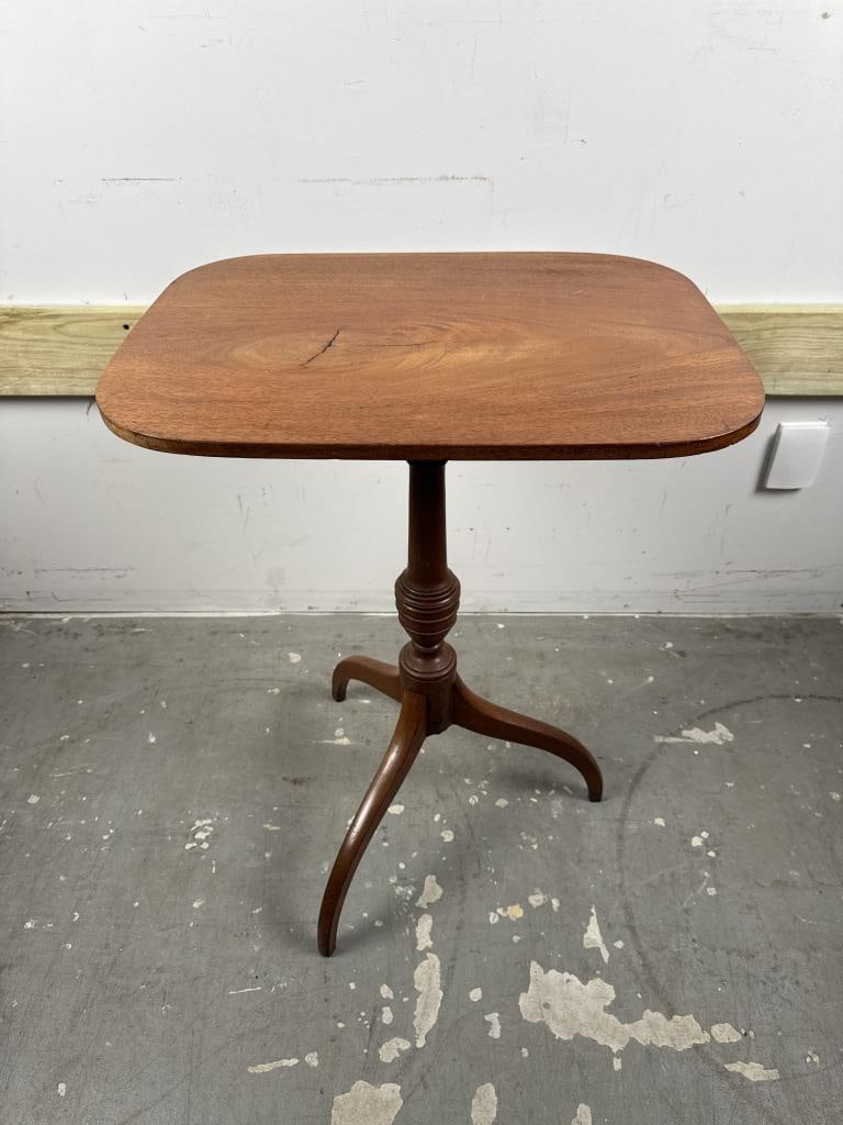 FEDERAL CANDLESTAND AND A CHANDELIER Heights 19" and 29.5".: FEDERAL CANDLESTAND AND A CHANDELIER 19th Century mahogany tilt-top candlestand with turned pedestal and spider legs. Reproduction wood and iron chandelier. Heights 19" and 29.5".