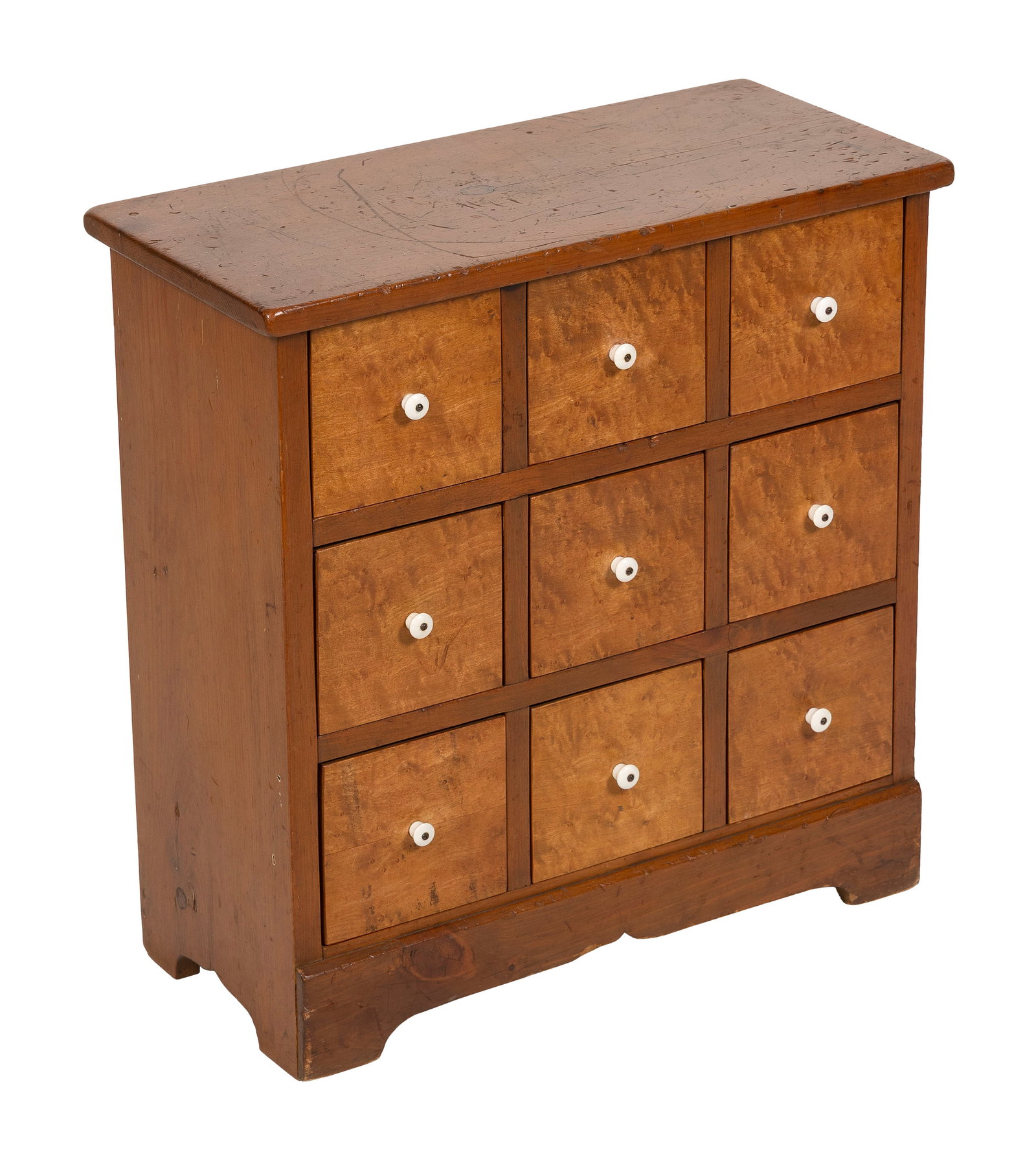 APOTHECARY CHEST 19th Century Height 21". Width 21". Depth 9.5".: APOTHECARY CHEST 19th Century Nine drawers with tiger maple fronts. Shaped base. Height 21". Width 21". Depth 9.5".