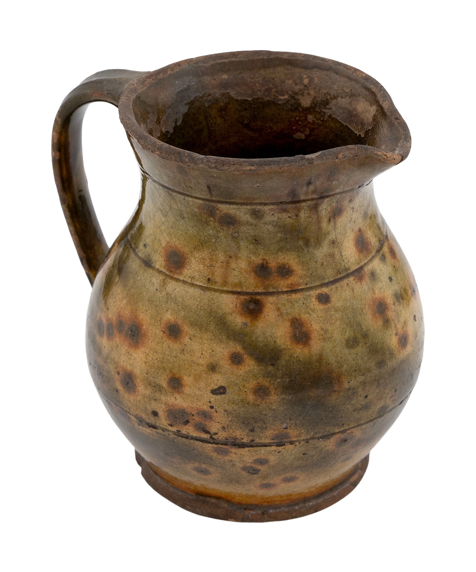 BRISTOL COUNTY, MASSACHUSETTS REDWARE POTTERY PITCHER Late 18th Century Height 6.5".: BRISTOL COUNTY, MASSACHUSETTS REDWARE POTTERY PITCHER Late 18th Century Three incised rings, one at neck, one at shoulder and one at waist. Applied strap handle. Yellow and brown halos against a light