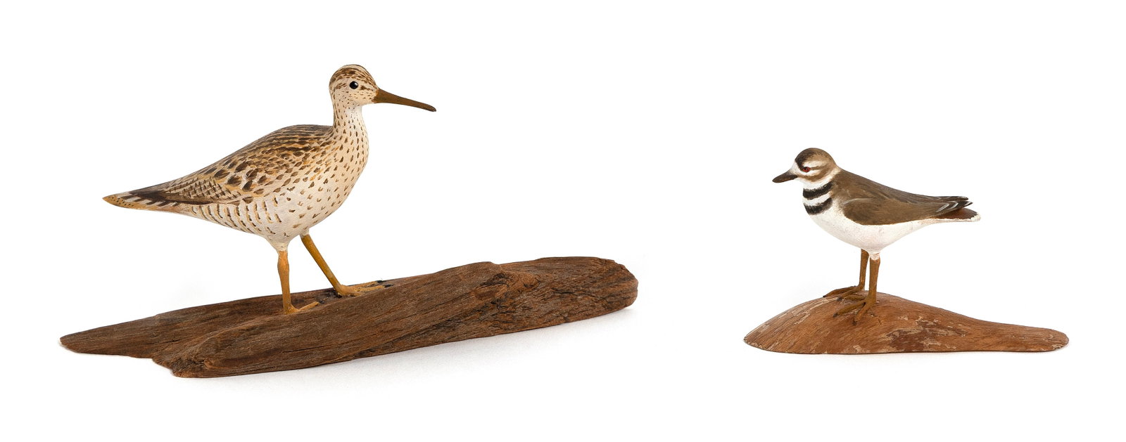 TWO HAROLD GIBBS MINIATURE SHOREBIRDS Barrington, Rhode Island, 1866-1970 Heights 1.75" and 2.75".: TWO HAROLD GIBBS MINIATURE SHOREBIRDS Barrington, Rhode Island, 1866-1970 A yellowlegs and a killdeer, both mounted on driftwood bases. Yellowlegs dated 1946. Heights 1.75" and 2.75".