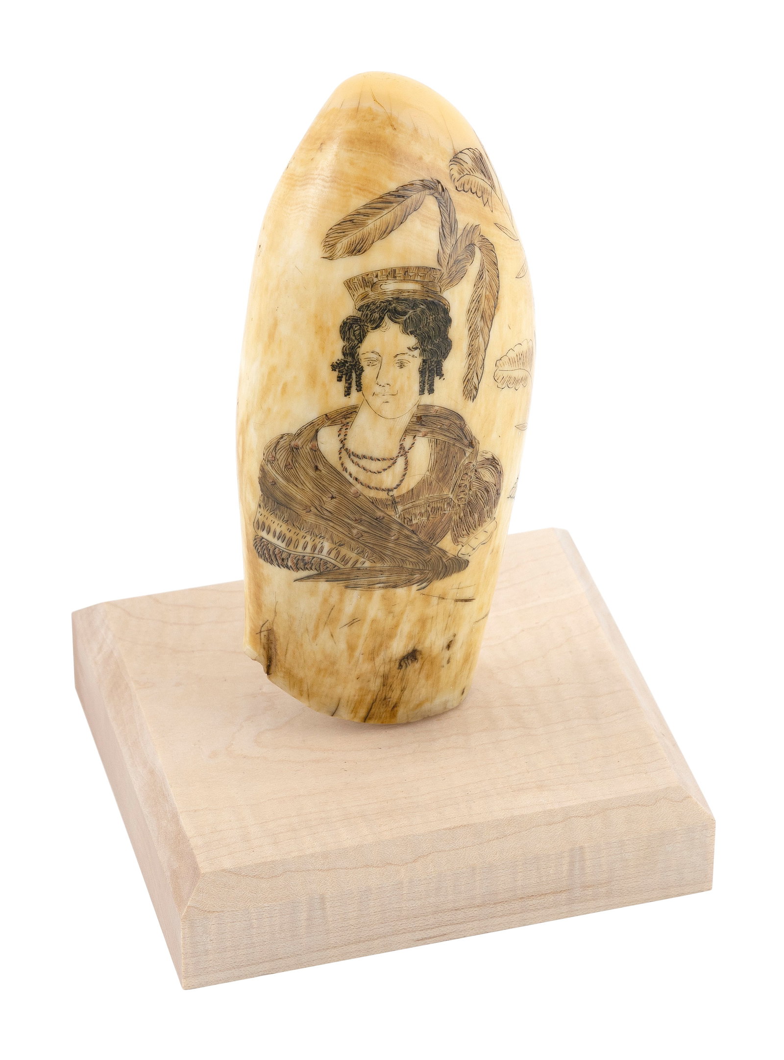 SCRIMSHAW WHALE'S TOOTH WITH FIGURAL PORTRAIT 19th Century Length 5.5". On a contemporary wood: SCRIMSHAW WHALE'S TOOTH WITH FIGURAL PORTRAIT 19th Century Obverse depicts a bust portrait of a woman in a flamboyant feathered hat and bead necklace. Foliate designs along one edge. Reverse depicts a