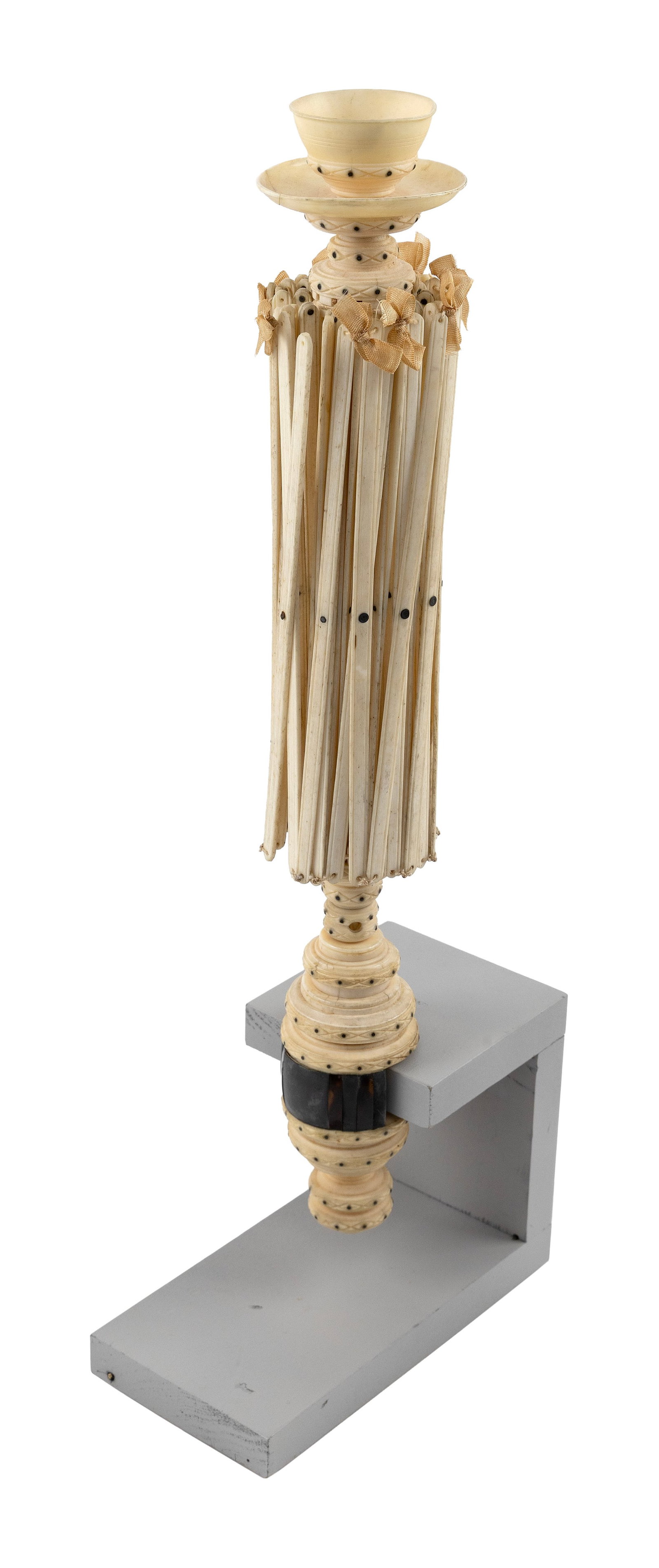 EXCEPTIONAL WHALEBONE AND IVORY DOUBLE CAGE SWIFT 19th Century Height 16.5".: EXCEPTIONAL WHALEBONE AND IVORY DOUBLE CAGE SWIFT 19th Century Topped with a yarn cup emulating a tea cup and saucer. Turned and carved shaft and clamp. Ebony pique inlay throughout. Height 16.5".