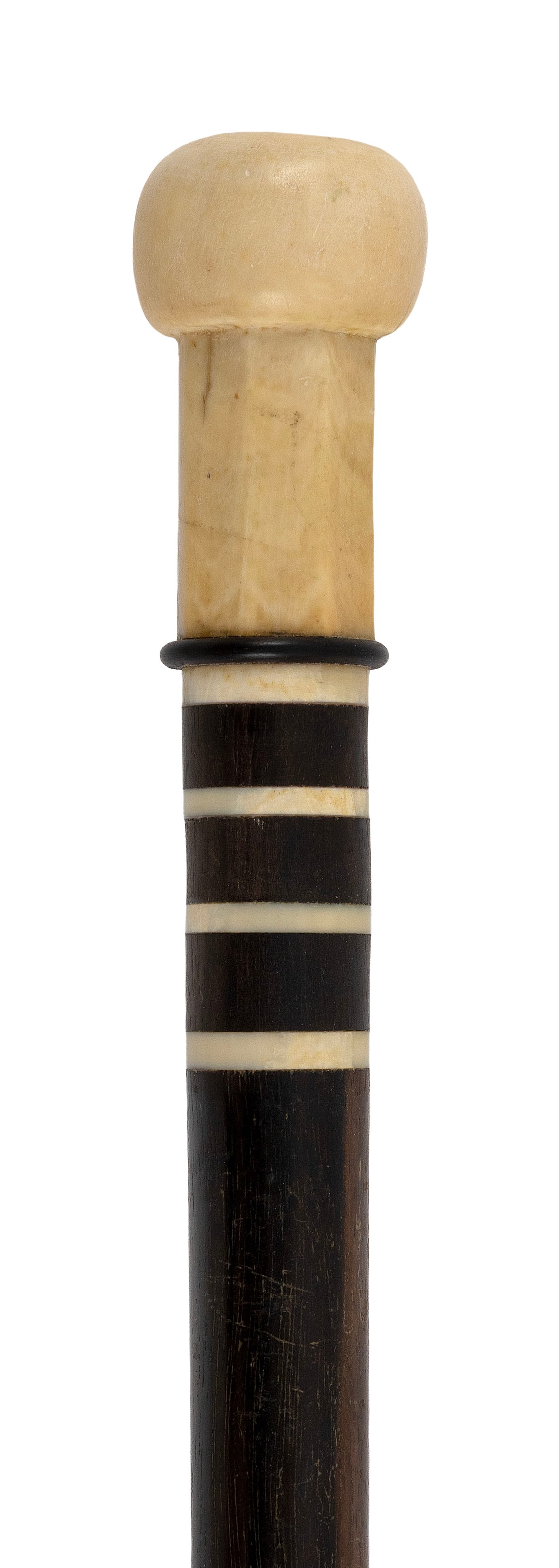 CANE WITH WHALE IVORY HANDLE 19th Century Length 37.5".: CANE WITH WHALE IVORY HANDLE 19th Century Handle carved as a flattened ball atop an octagonal plinth. Throat with whale ivory and island wood banding. Hardwood shaft with whalebone ferrule. Length 37.