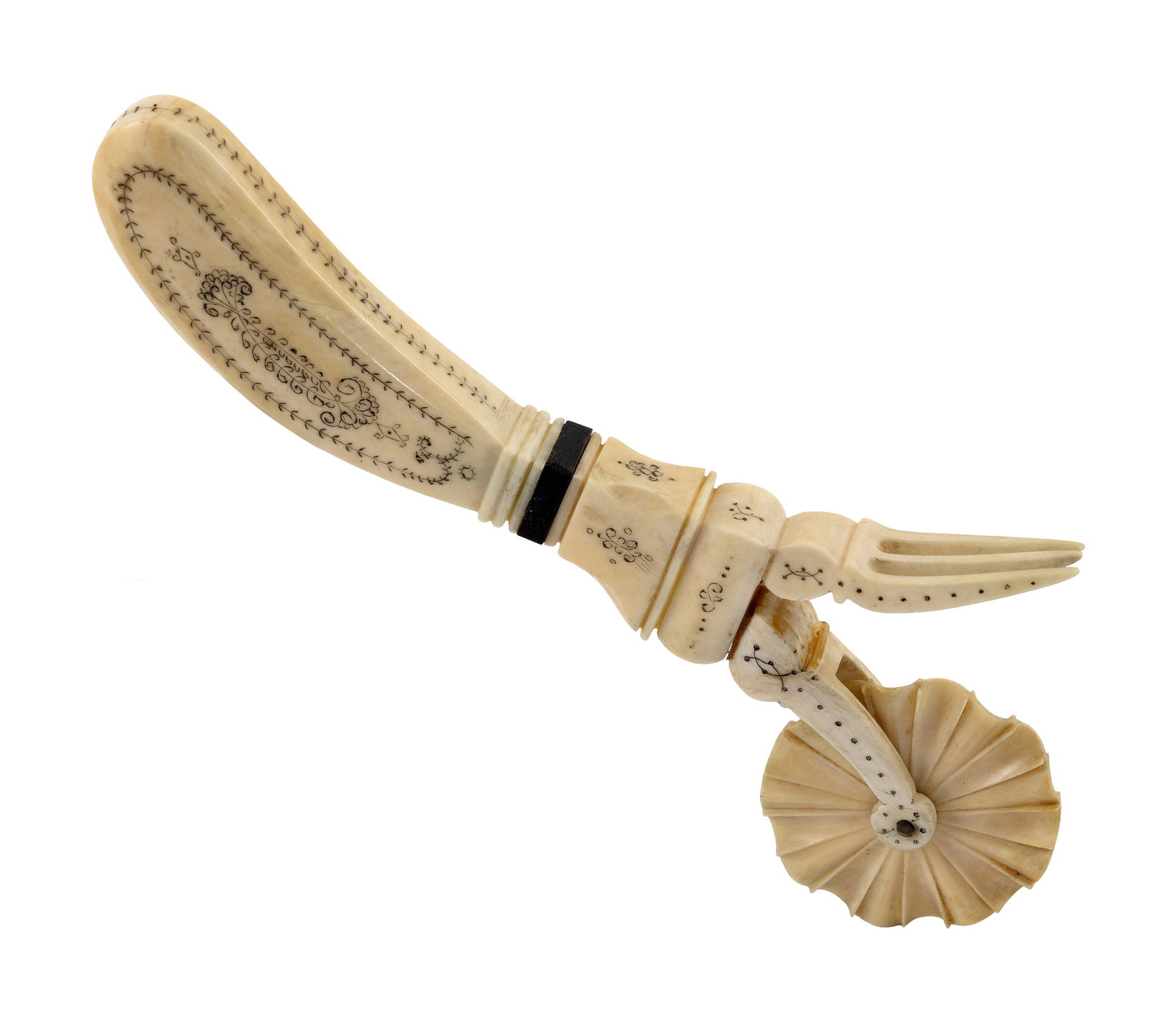 POLYCHROME SCRIMSHAW WHALE IVORY PIE CRIMPER 19th Century Length 8".: POLYCHROME SCRIMSHAW WHALE IVORY PIE CRIMPER 19th Century Pistol-grip handle engraved with a berry vine on one side, an elaborate scroll and vine design on the other side, and a slender vine on the ed