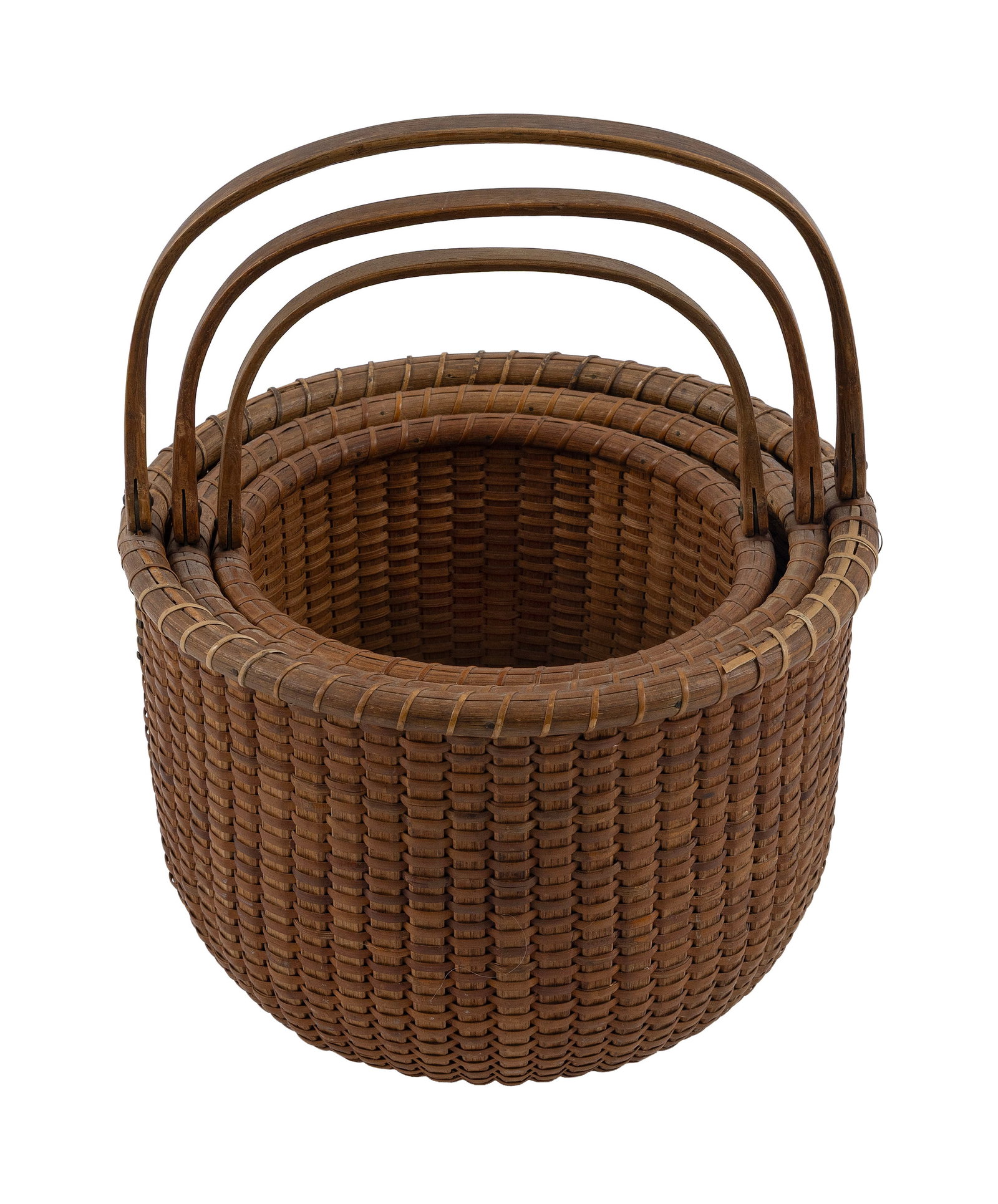 NEST OF THREE NANTUCKET BASKETS Early 20th Century Height to rims from 4.75" to 6.25". Diameters (1 of 1)