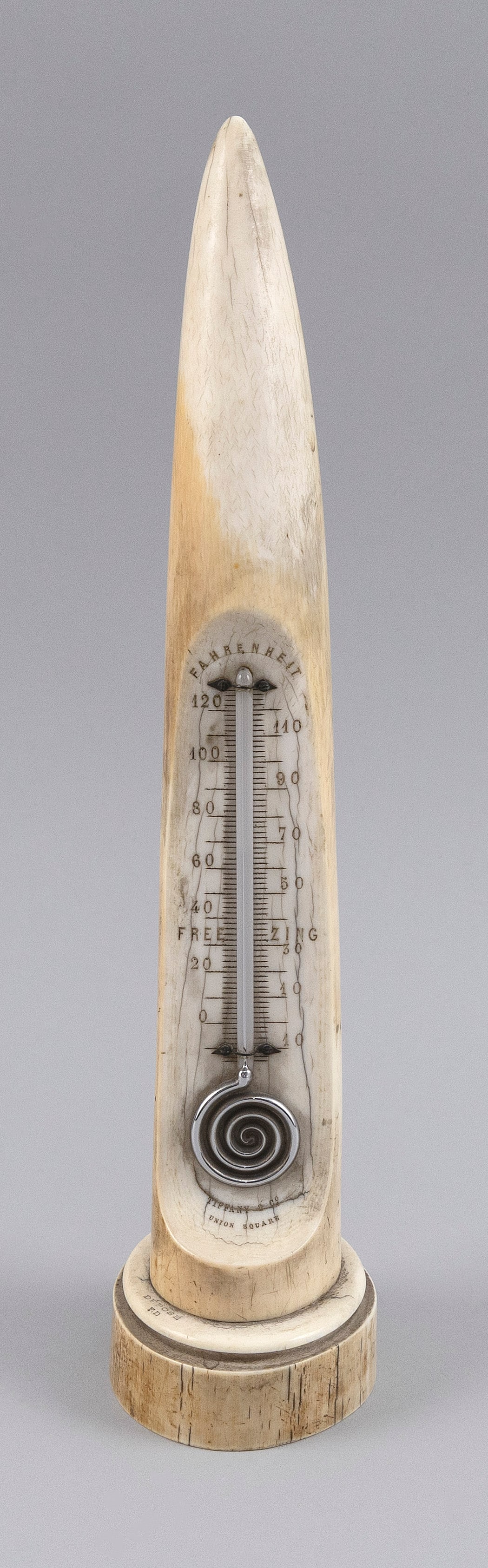 TIFFANY & CO. CARVED IVORY DESKTOP THERMOMETER Late 19th Century Height 11.25".: TIFFANY & CO. CARVED IVORY DESKTOP THERMOMETER Late 19th Century Engraved Fahrenheit degree scale. Spiral mercury bulb. Marked on base "Tiffany & Co. Union Square". Height 11.25".