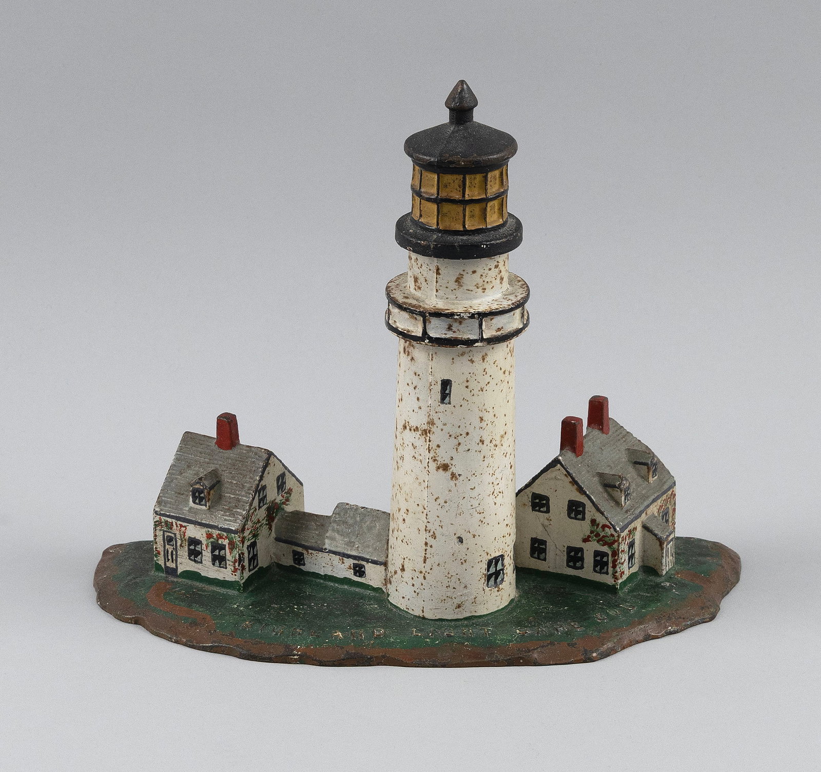 CAST IRON HIGHLAND LIGHT DOORSTOP Early 20th Century Height 8.25". (1 of 3)