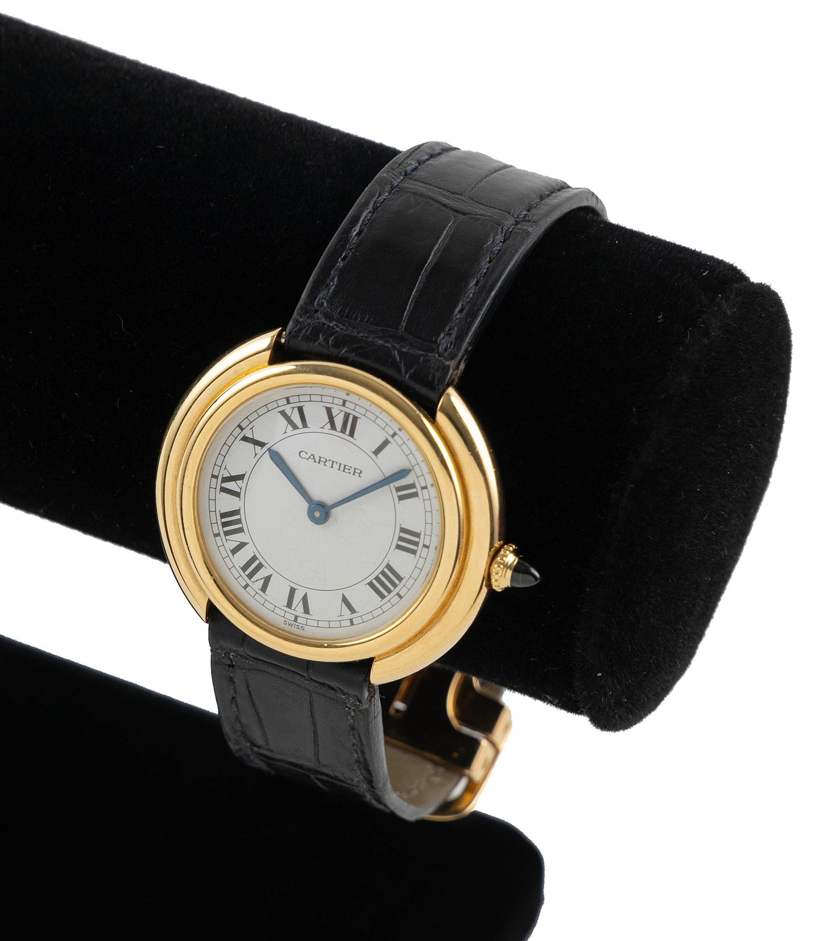 18KT CARTIER VENDOME WATCH 1980s Approx. 27.0 total dwt.: 18KT CARTIER VENDOME WATCH 1980s White dial with black Roman numerals and sapphire crown. Original Cartier black leather band with 18kt deployant buckle. Stamped. Band length 7". Case diameter approx.