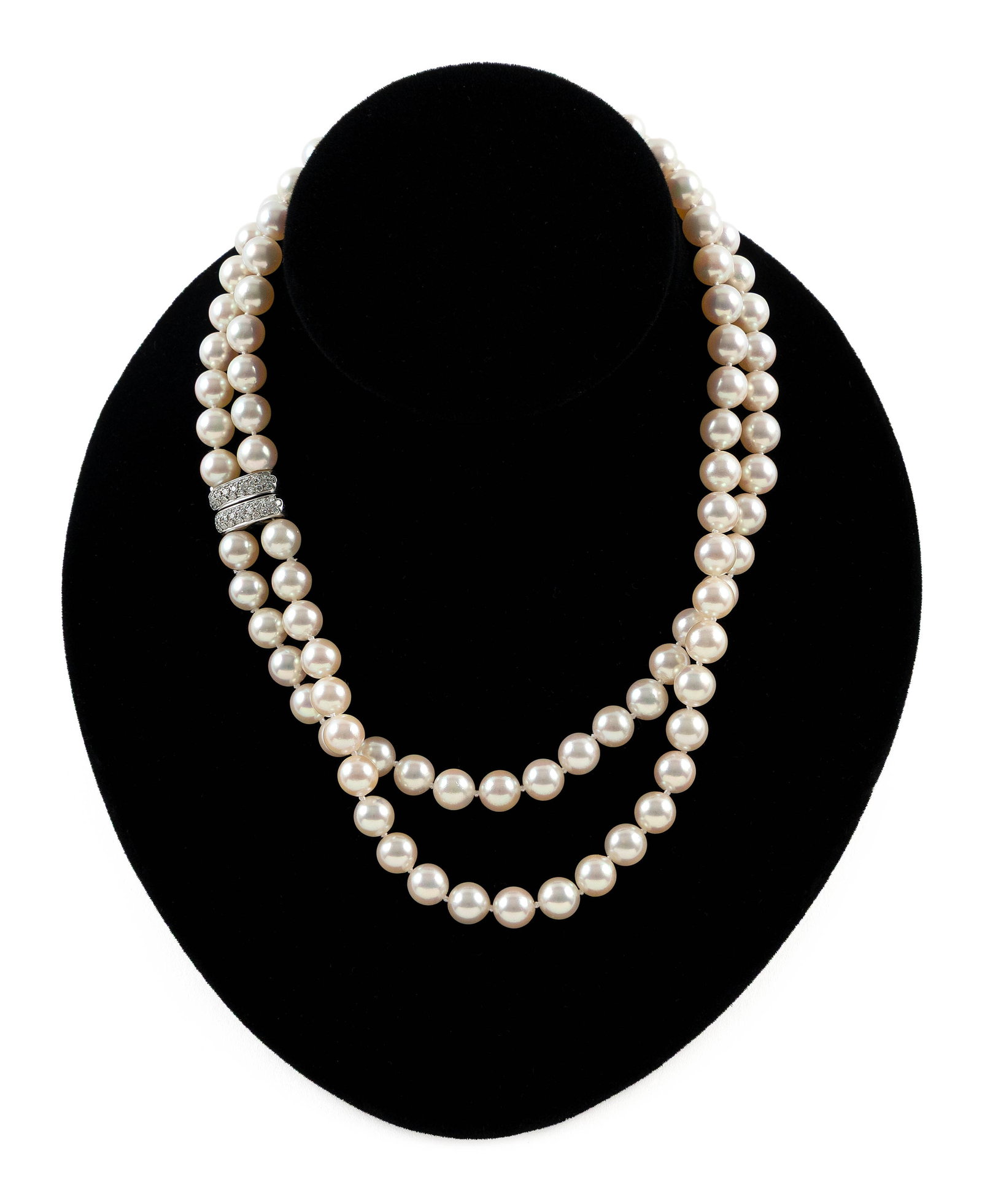 CELLINI 18KT WHITE GOLD, CULTURED PEARL AND DIAMOND NECKLACE: CELLINI 18KT WHITE GOLD, CULTURED PEARL AND DIAMOND NECKLACE Double strand of approx. 8.0mm round pearls. Safety clasp, approx. 10.0 x 16.0mm, with 50 small round diamonds, approx. 0.50 ctw. Stamped. 