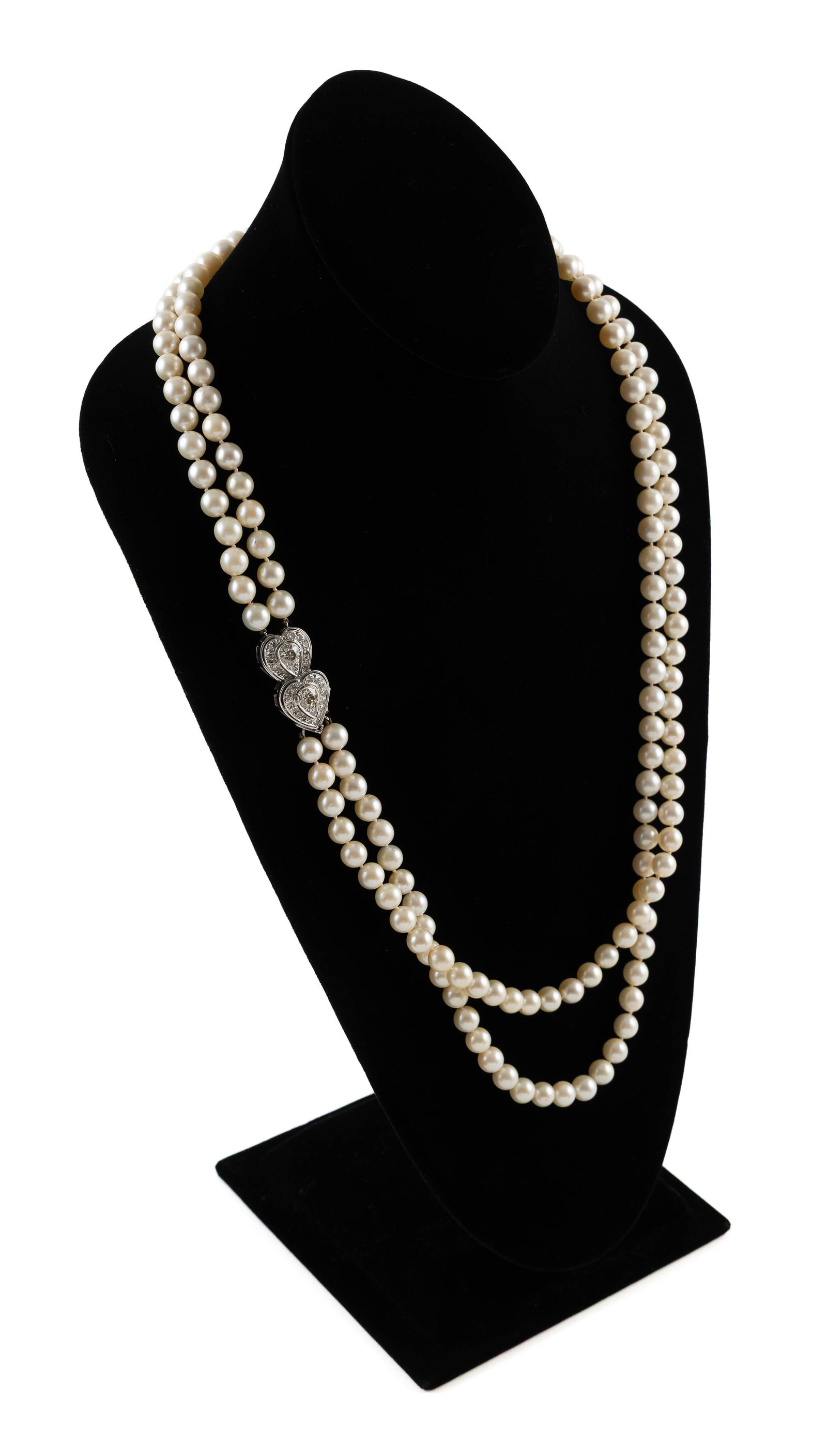 14KT WHITE GOLD, DIAMOND AND CULTURED PEARL NECKLACE: 14KT WHITE GOLD, DIAMOND AND CULTURED PEARL NECKLACE Double strand of approx. 8.0mm round cultured pearls. Double-heart clasp, approx. 16.0 x 32.0mm, with two approx. 0.75 ct. old European-cut diamond