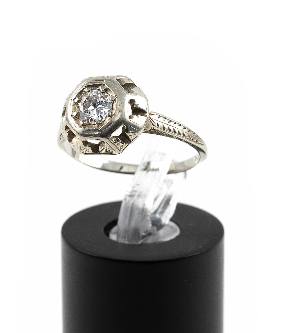 ART DECO-STYLE 18KT WHITE GOLD AND DIAMOND ENGAGEMENT RING Approx. 1.9 total dwt.: ART DECO-STYLE 18KT WHITE GOLD AND DIAMOND ENGAGEMENT RING One approx. 0.33 ct. round-cut diamond, approx. G-H color, VS1 clarity. Stamped. Approx. 10.0 x 11.5mm. Size 6. Approx. 1.9 total dwt.