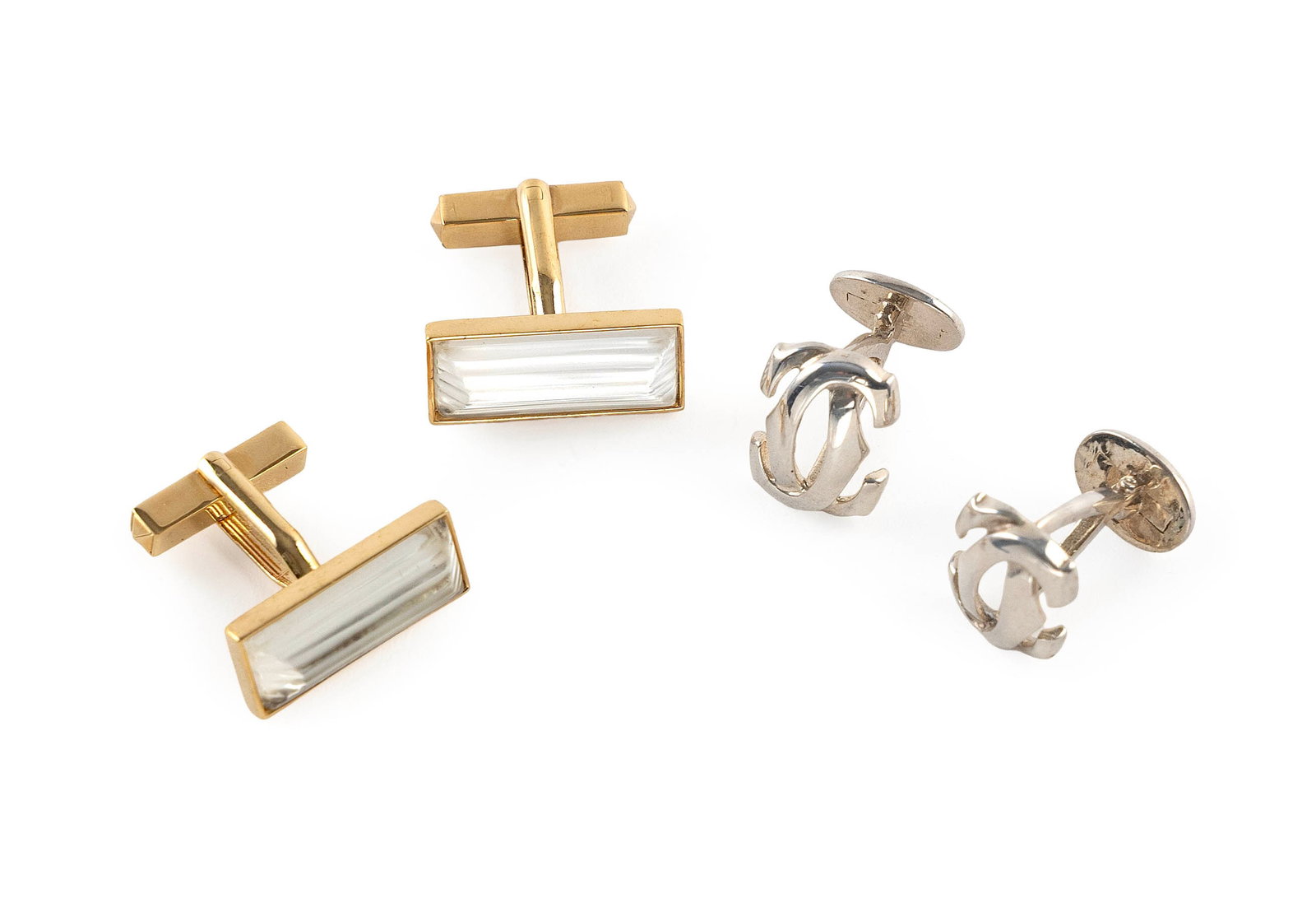 TWO PAIRS OF CUFF LINKS: TWO PAIRS OF CUFF LINKS 1) Cartier sterling silver double "C" logo. Stamped "Cartier". Fixed backs. Approx. 12.0 x 15.0mm. 2) Lalique gold tone crystal. Toggle backs. Stamped "Lalique". Approx. 9.0 x 