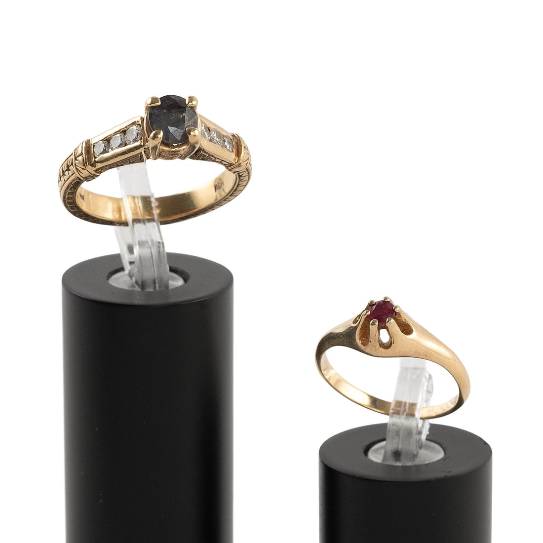 TWO 14KT YELLOW GOLD AND STONE RINGS Approx. 5.3 total dwt.: TWO 14KT YELLOW GOLD AND STONE RINGS 1) One approx. 3.0mm round-cut ruby. Size 5. 2) One approx. 5.0 x 5.5mm sapphire and six small round-cut diamonds, approx. 0.15 ctw. Size 8. Both stamped. Approx. 