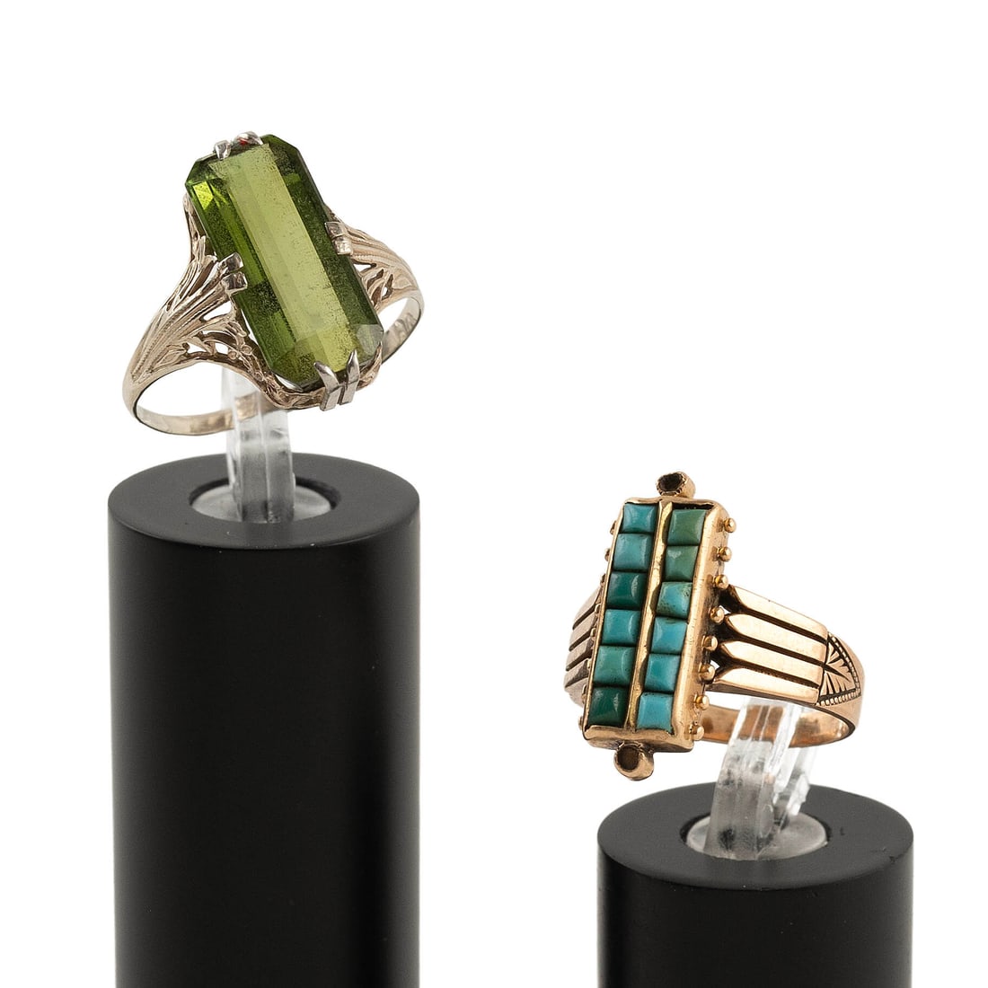 TWO VINTAGE ART DECO 14KT GOLD AND STONE RINGS Approx. 4.5 total dwt.: TWO VINTAGE ART DECO 14KT GOLD AND STONE RINGS 1) White gold with one approx. 8.0 x 16.0mm emerald-cut peridot. Size 8?. 2) Yellow gold with 12 small faceted square-cut turquoise stones. Approx. 8.0 x