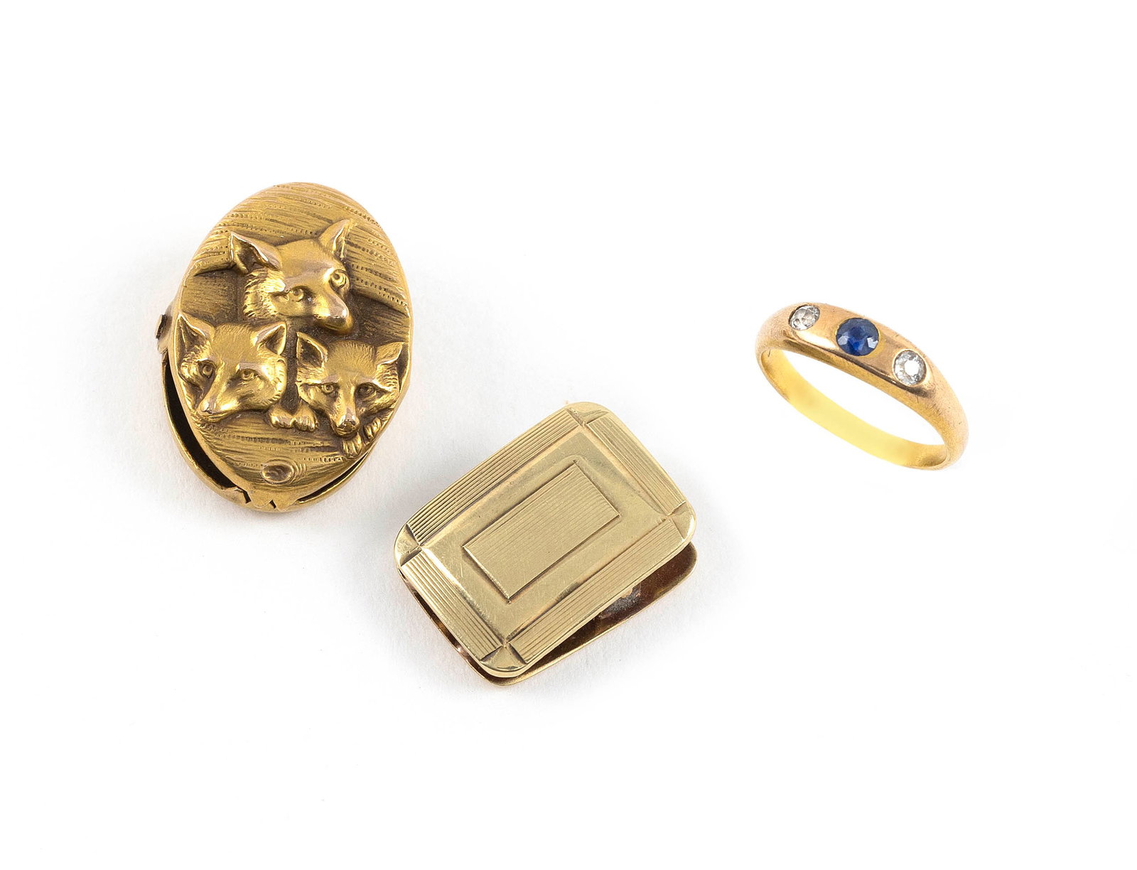 THREE PIECES OF VINTAGE YELLOW GOLD JEWELRY 14kt approx. 2.8 dwt., 10kt approx. 1.7 dwt.: THREE PIECES OF VINTAGE YELLOW GOLD JEWELRY 1) 14kt baby's ring with a small sapphire and two small old mine-cut diamonds. Smaller than size 1. 2) 14kt sweater clip. Approx. 11.0 x 16.0mm. 3) 10kt swe