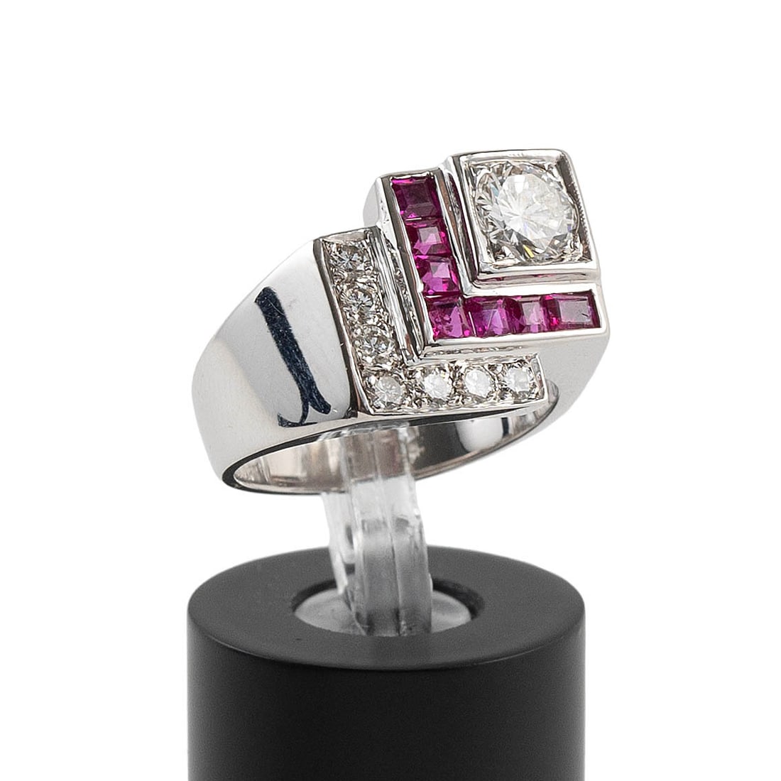 14KT YELLOW GOLD, DIAMOND AND RUBY RING Approx. 4.4 total dwt.: 14KT YELLOW GOLD, DIAMOND AND RUBY RING One approx. 0.50 ct. round-cut diamond, approx. VS2 clarity, I-J color, seven small square cut rubies, seven small single-cut diamonds. Stamped. Approx. 12.0 x 