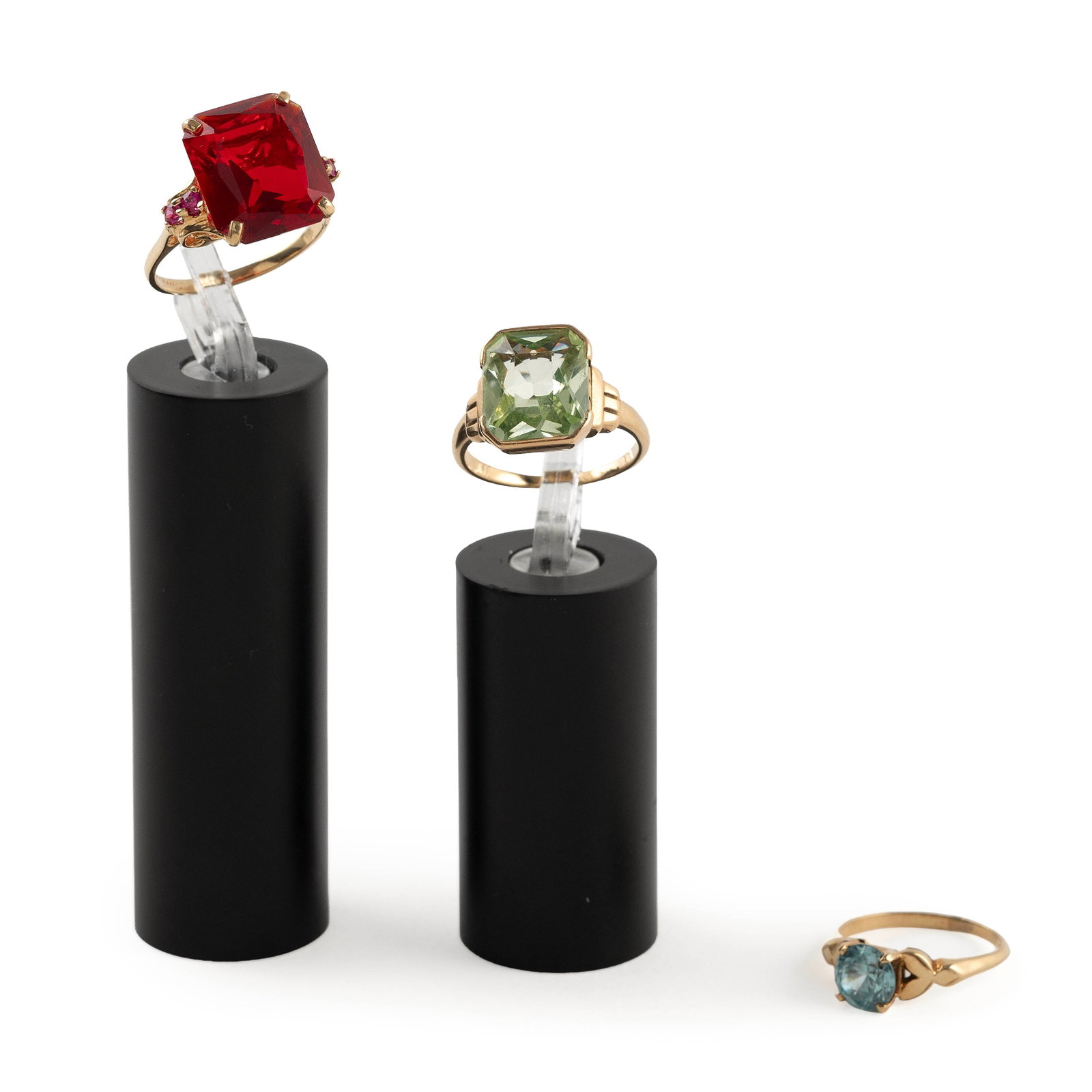 THREE 14KT YELLOW GOLD RINGS Approx. 6.5 total dwt.: THREE 14KT YELLOW GOLD RINGS 1) One approx. 7.0mm round blue topaz. Size 5?. 2) One approx. 10.0 x 13.0mm faceted blue quartz. Size 6?. 3) One approx. 12.0 x 14.0mm faceted simulated ruby with four sm