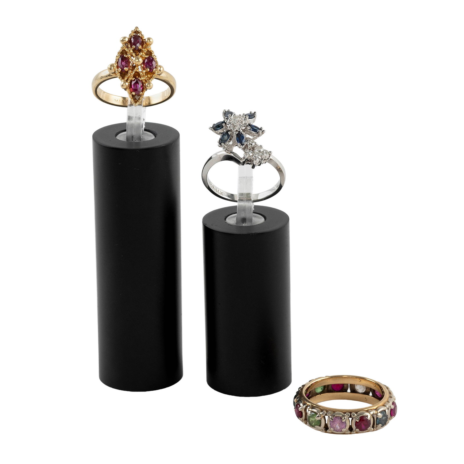 THREE 14KT YELLOW GOLD RINGS Approx. 8.8 total dwt.: THREE 14KT YELLOW GOLD RINGS 1) Band with 12 assorted colored stones, one stone missing. Width approx. 6.0mm. Size 7?. 2) Bypass style with an approx. 13.0mm round cluster with a small central round-c