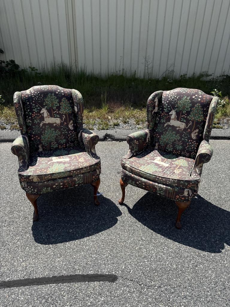 PAIR OF WING CHAIRS WITH WHIMSICAL UPHOLSTERY 20th Century Back heights 42.25".: PAIR OF WING CHAIRS WITH WHIMSICAL UPHOLSTERY 20th Century Dark brown cotton upholstery with unicorns, monkeys, cheetahs, flowering trees and flowers in shades of light brown, green, orange and cream.