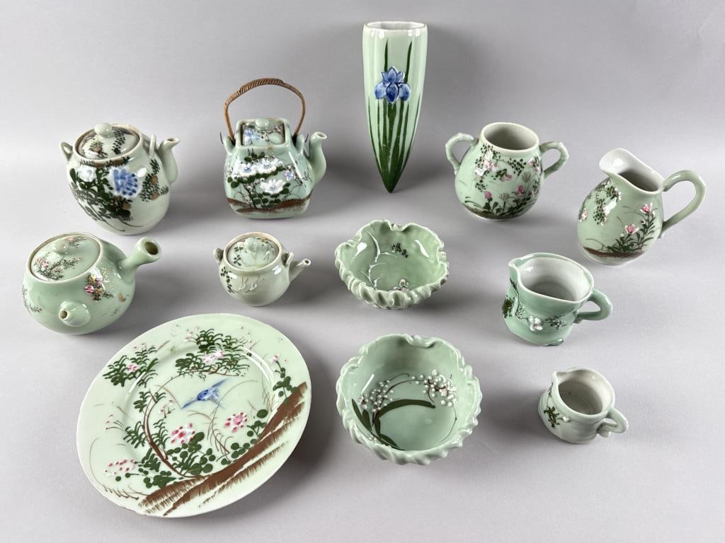 TWELVE PIECES OF JAPANESE CELADON GLAZE RELIEF-MOLDED PORCELAIN Early to Mid-20th Century: TWELVE PIECES OF JAPANESE CELADON GLAZE RELIEF-MOLDED PORCELAIN Early to Mid-20th Century 1-2) Two teapots. Heights 5" and 5.5". 3) Plate. Diameter 8.5". 4) Wall pocket. Height 8.5". 5-7) Three small 