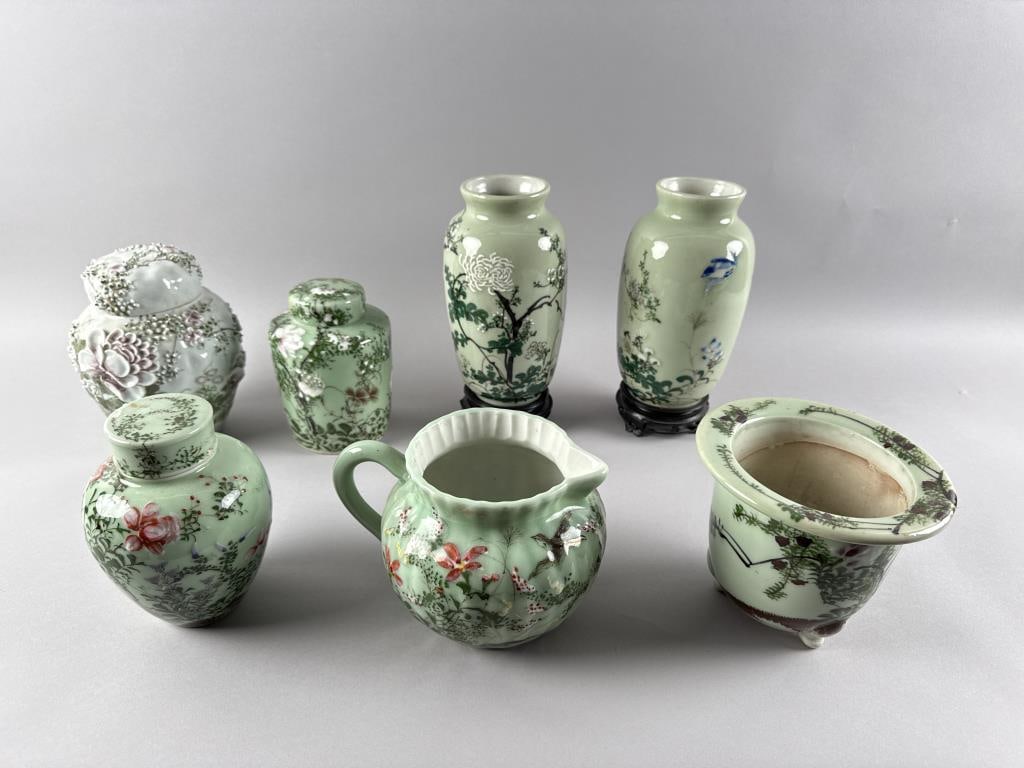 SEVEN PIECES OF JAPANESE CELADON GLAZE RELIEF-MOLDED PORCELAIN Early to Mid-20th Century: SEVEN PIECES OF JAPANESE CELADON GLAZE RELIEF-MOLDED PORCELAIN Early to Mid-20th Century 1-2) Pair of vases. Heights 8.5". 3) Planter. Height 5.5". 4) Pitcher. Height 5.5". 5) Ginger jar with floral d