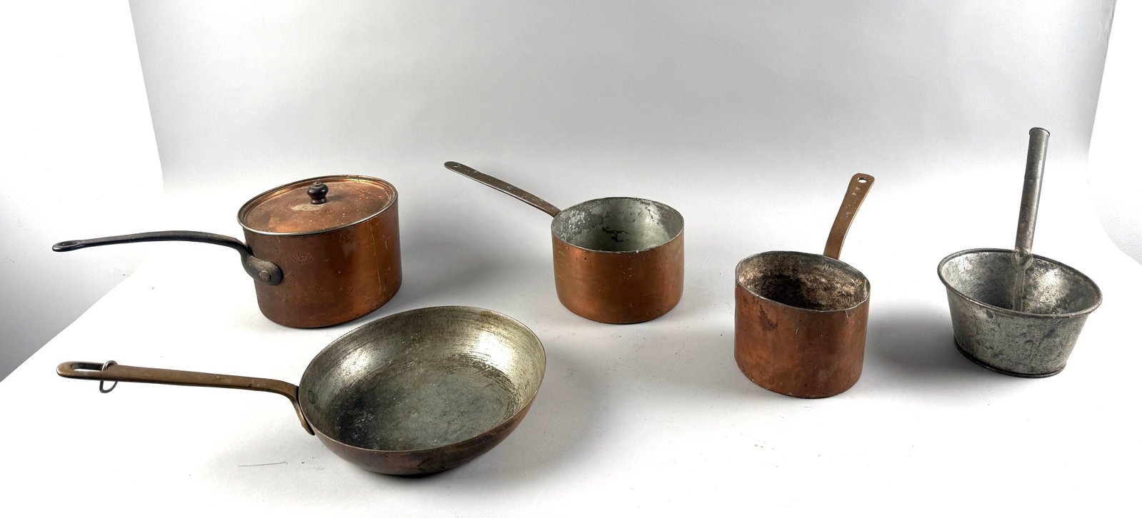 FIVE PIECES OF COPPER AND TIN COOKWARE Late 19th/Early 20th Century Diameters from 5.25" to 9.25". (1 of 1)