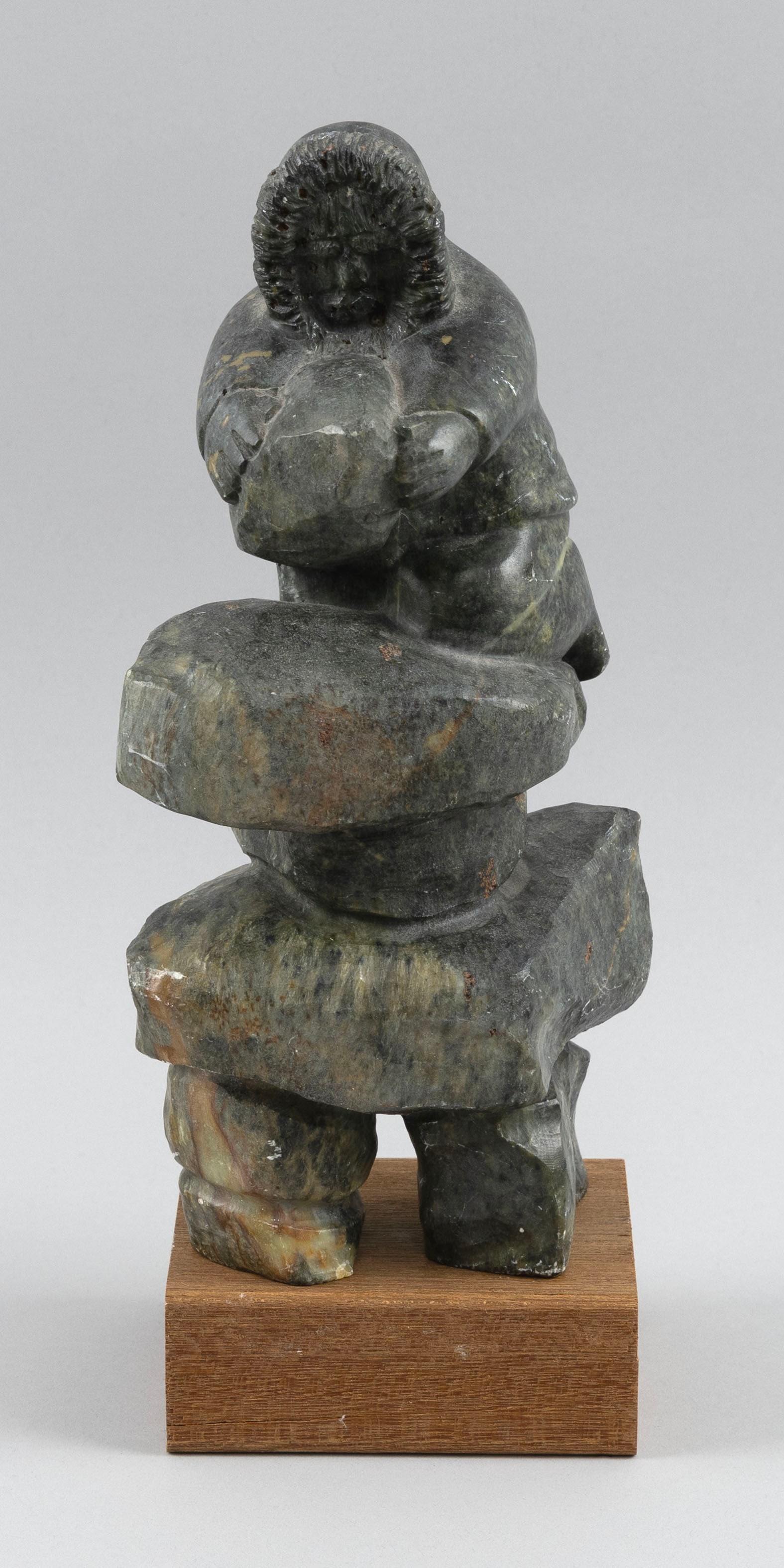 FRED IYAK TRIMBLE (Inuvik, Northwest Territories, 1961-), Soapstone Inuit figure., Height 10". On a (1 of 6)