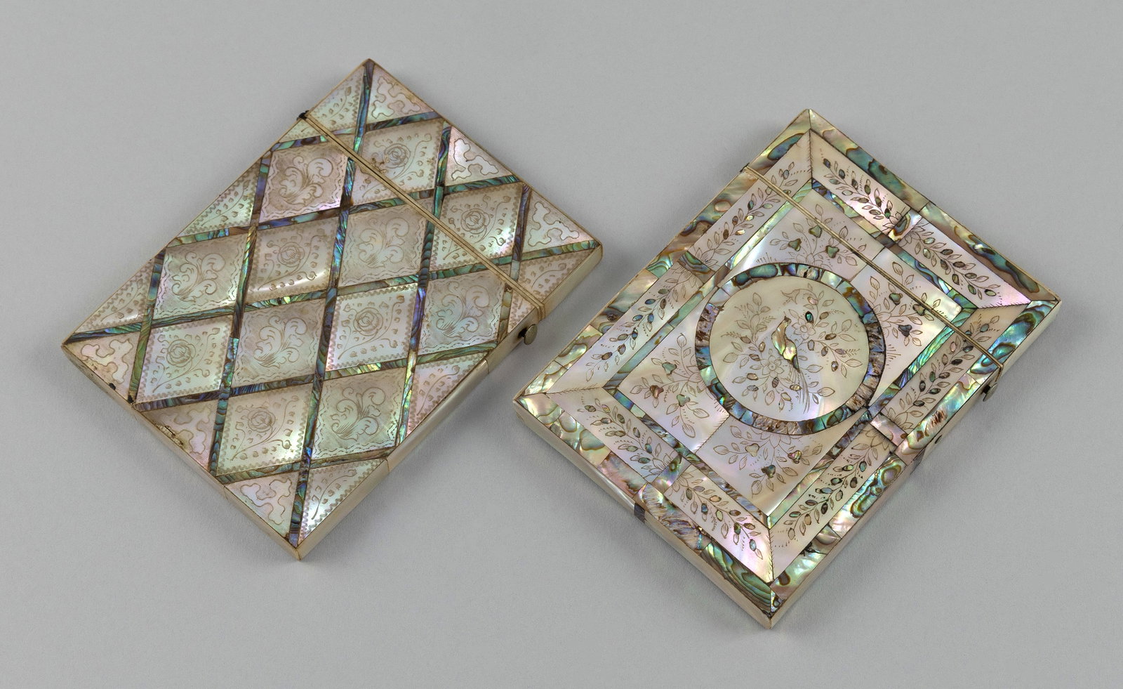TWO EXCEPTIONAL IVORY AND MOTHER-OF-PEARL CALLING CARD CASES 19th Century Both approx. 4.25" x: Y Y TWO EXCEPTIONAL IVORY AND MOTHER-OF-PEARL CALLING CARD CASES 19th Century Both with detailed engravings and abalone inlay, one with repeated floral motifs and the other with a circular medallion d