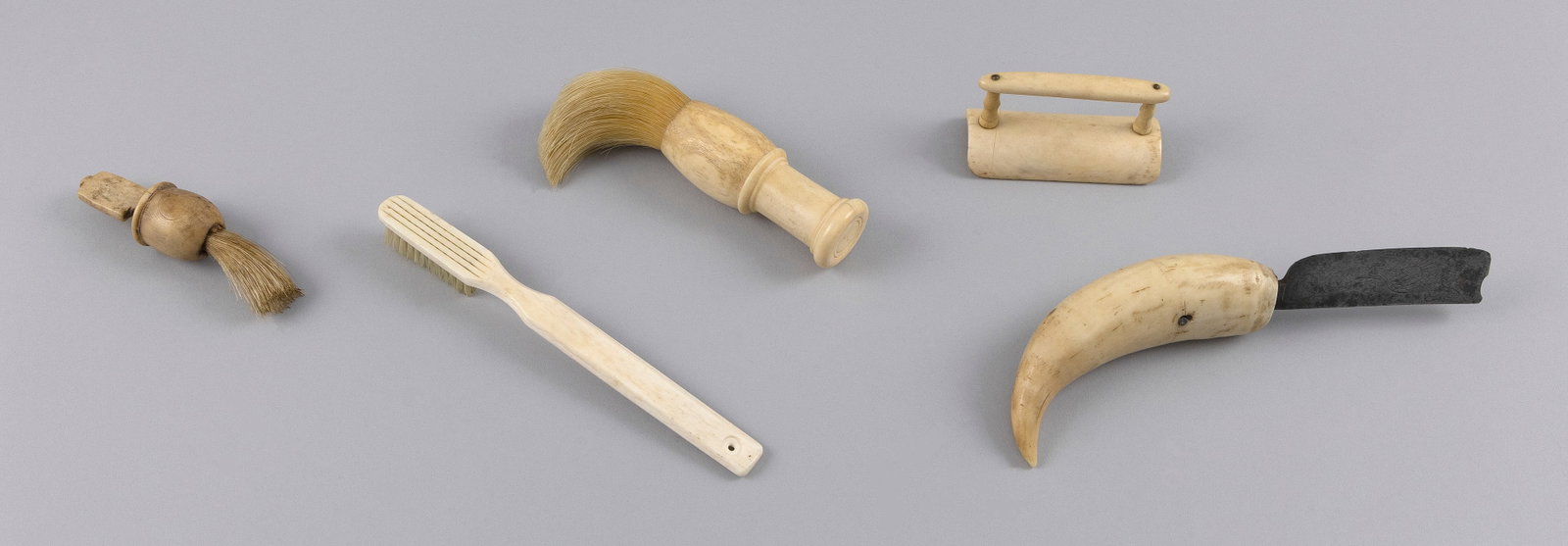 FIVE CARVED BONE UTILITARIAN ITEMS 19th/Early 20th Century Lengths from 3" to 7". (1 of 3)