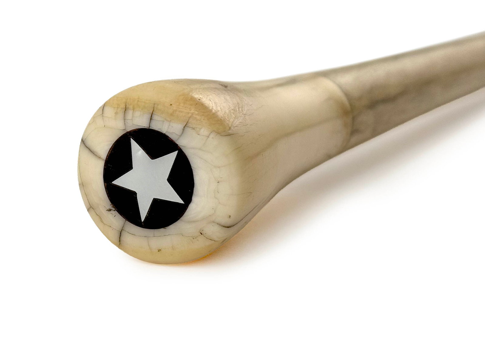 WHALE IVORY AND WHALEBONE CANE 19th Century Length 33".: WHALE IVORY AND WHALEBONE CANE 19th Century Turned whale ivory capstick handle, the top inlaid with an island wood disk centered by a mother-of-pearl star. Whalebone shaft with brass ferrule. Length 3