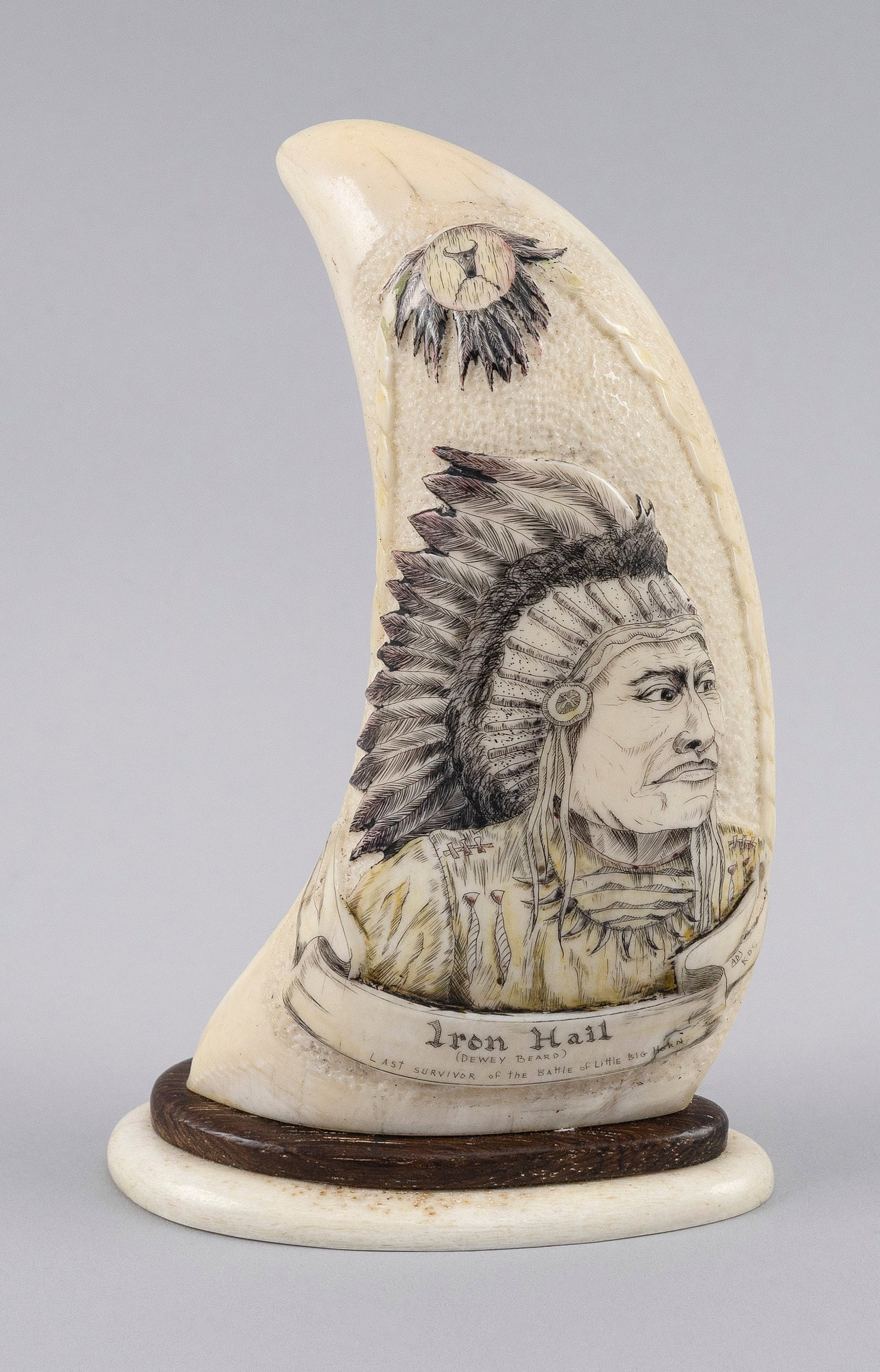 * ENGRAVED WHALE'S TOOTH "IRON HAIL" 20th Century Length 5.5".: * ENGRAVED WHALE'S TOOTH "IRON HAIL" 20th Century Depicts the bust of a Native American. * Per Federal Regulation, this item may only be purchased by a Massachusetts resident and will not be shipped o