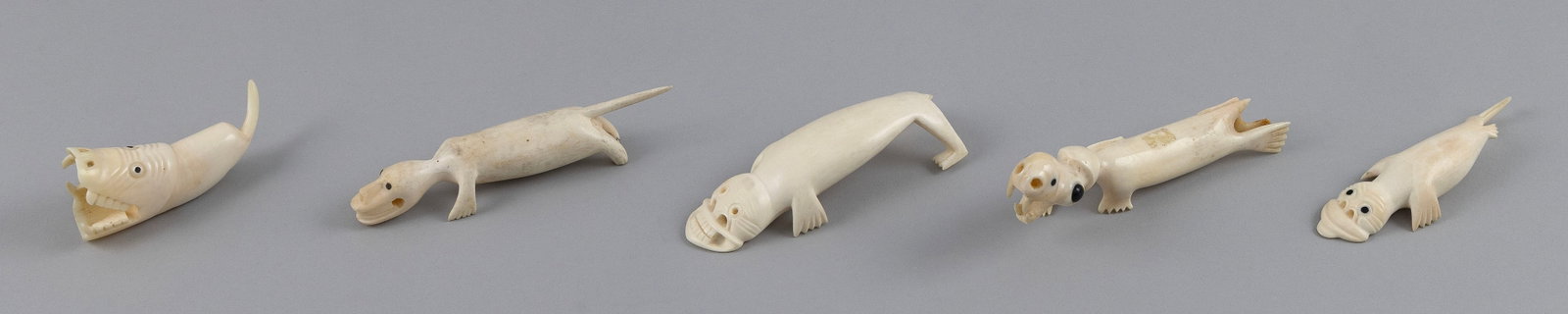 FIVE INUIT CARVED IVORY TUPILAKS Greenland, 20th Century Lengths from 3.25" to 5". (1 of 5)