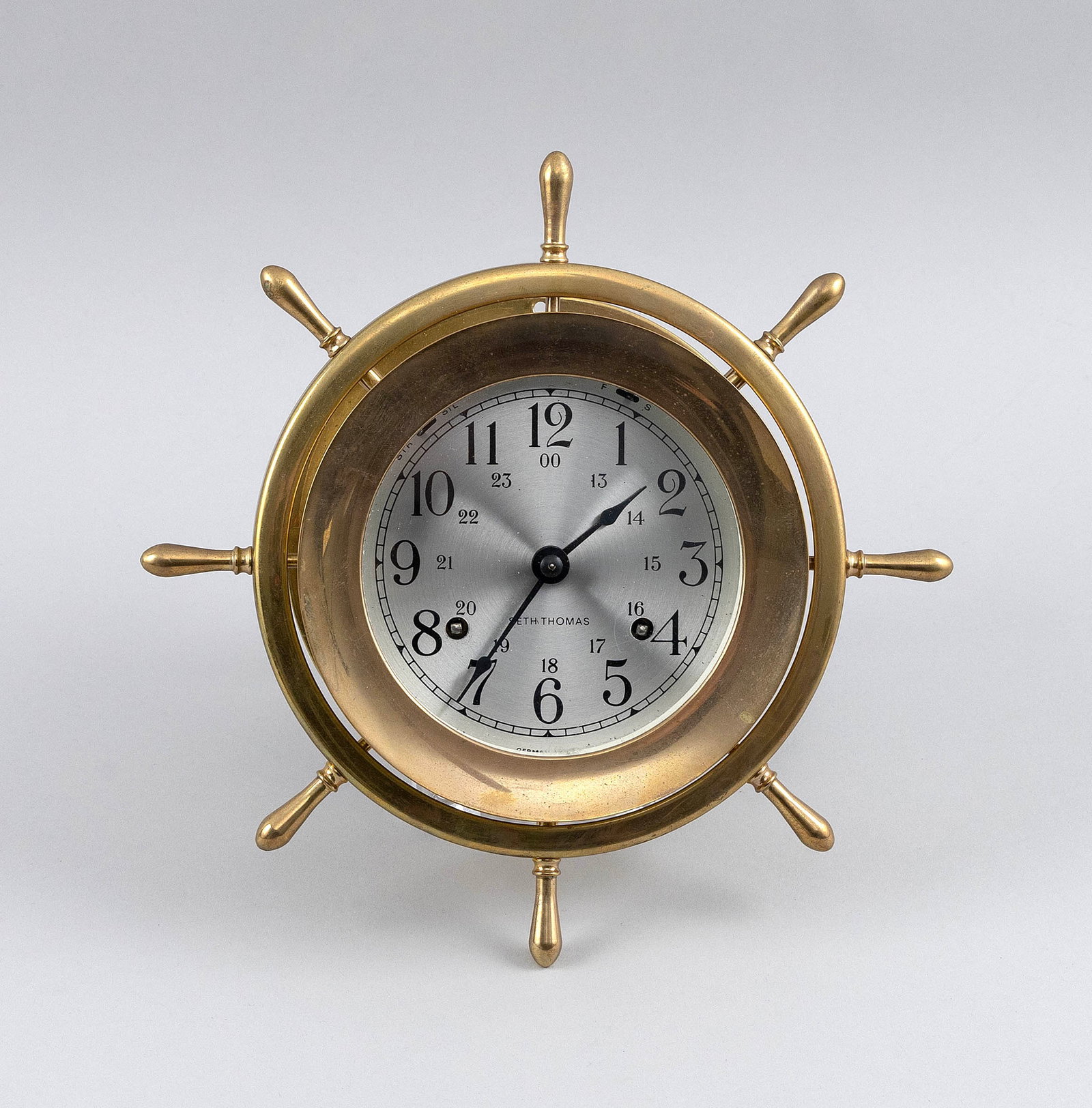 SETH THOMAS SHIP'S WHEEL BELL CLOCK 20th Century Diameter 4".: SETH THOMAS SHIP'S WHEEL BELL CLOCK 20th Century Arabic numeral dial marked "Seth Thomas". Includes key. Diameter 4".