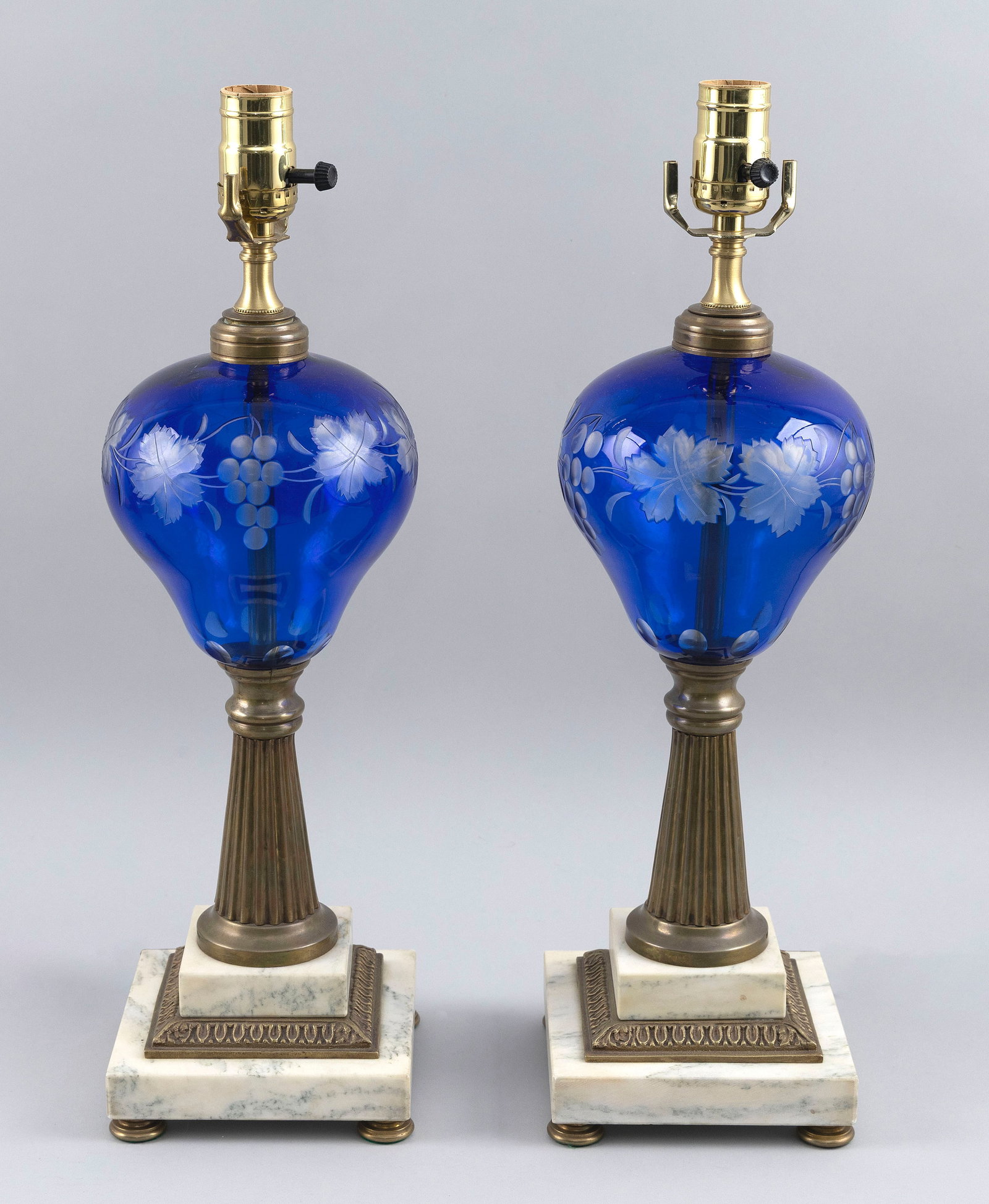 PAIR OF CUT OVERLAY GLASS TABLE LAMPS, POSSIBLY PAIRPOINT Late 19th Century Heights to collar 14.5". (1 of 2)