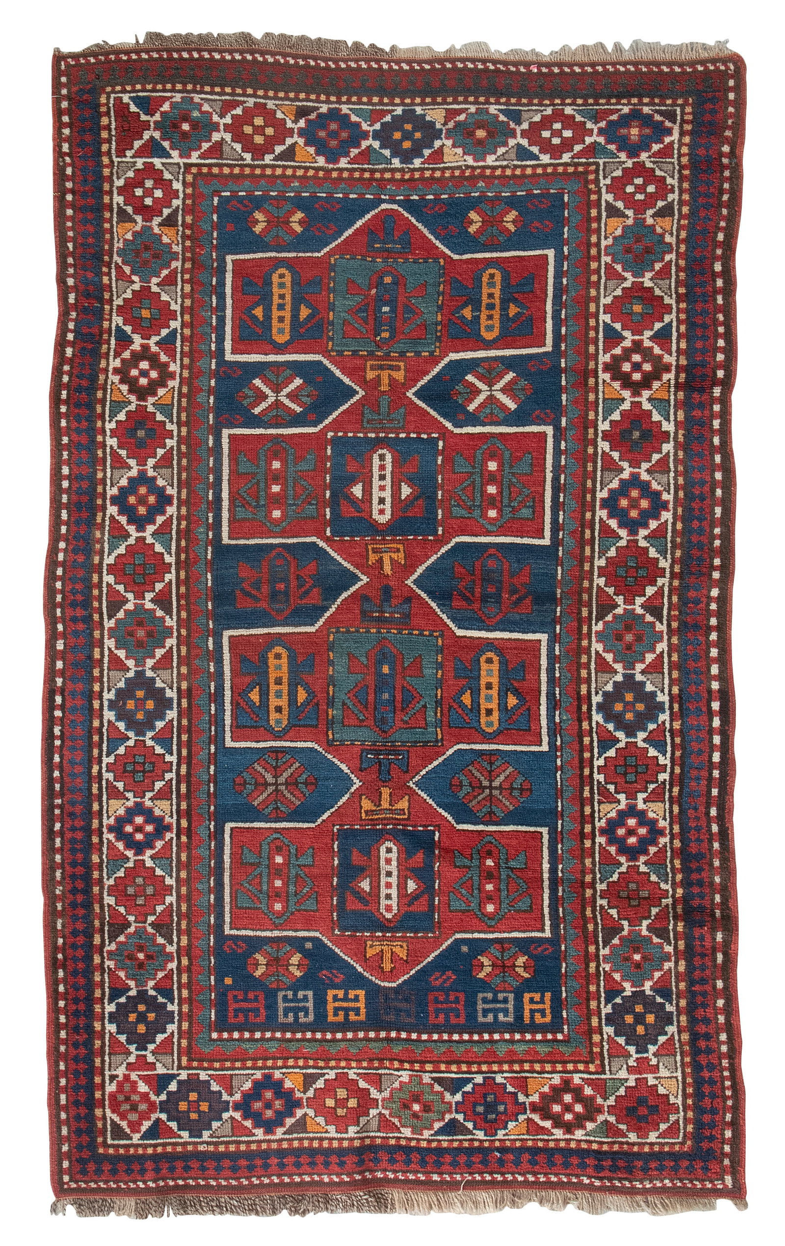 KAZAK RUG: 3'8" X 6'0" Second Quarter of the 20th Century: KAZAK RUG: 3'8" X 6'0" Second Quarter of the 20th Century Shield-form blood red medallion contains and is surrounded by stylized blue, aqua, red, ivory and light tangerine elements on a marine blue fi