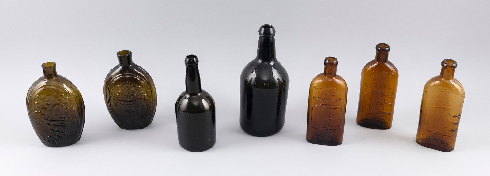 SEVEN ANTIQUE GLASS BOTTLES 18th/19th Century Heights from 7" to 9". (1 of 2)