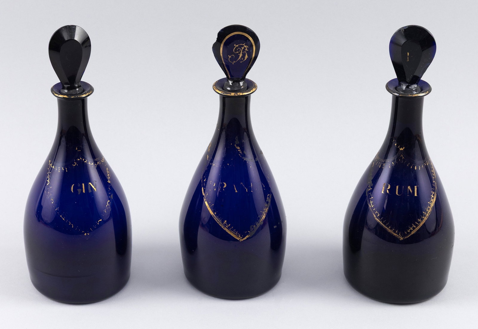 THREE COBALT BLUE GLASS LIQUOR BOTTLES 19th Century Heights 9". (1 of 2)
