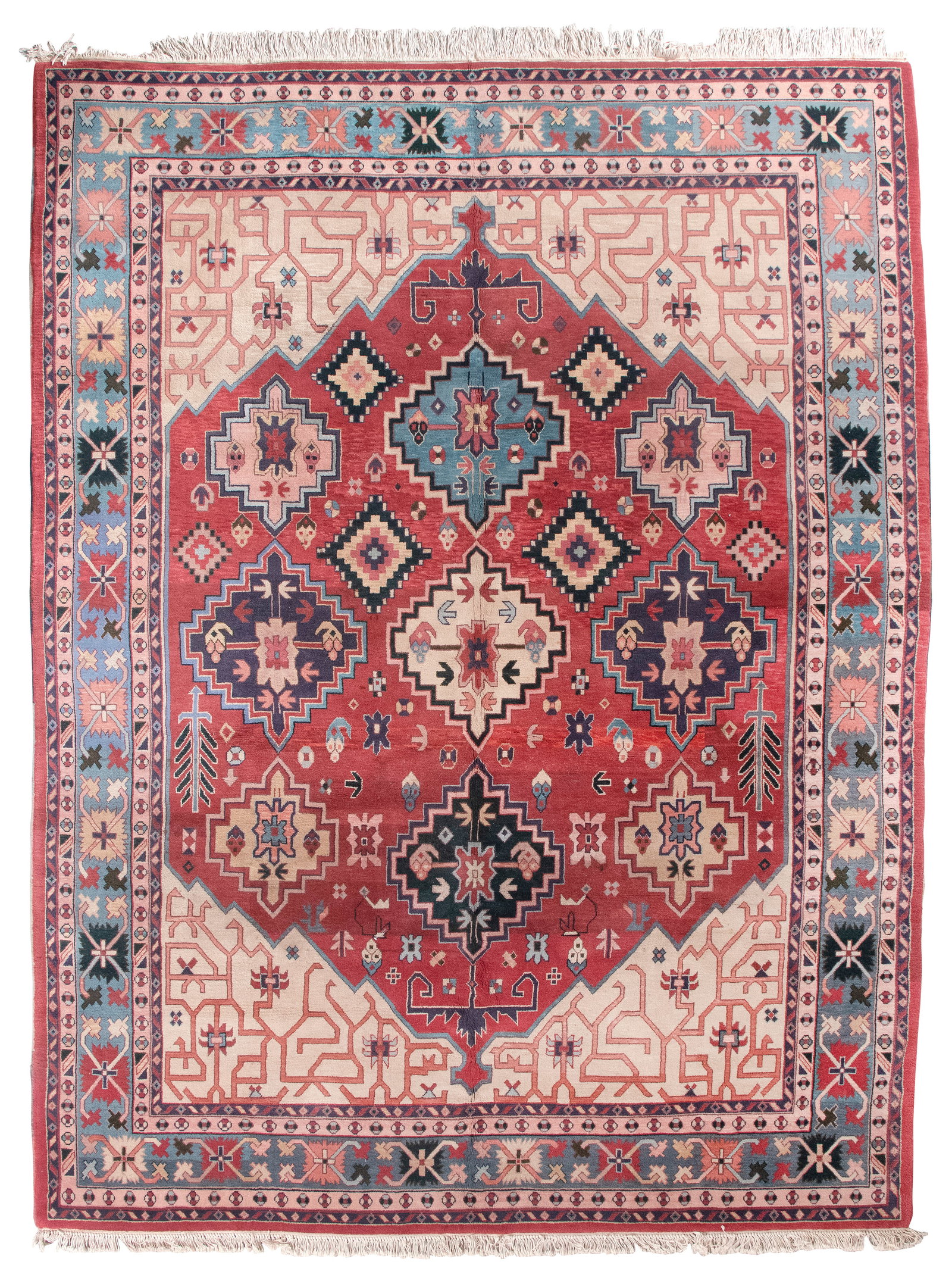 CAUCASIAN DESIGN RUG: 9'0" X 11'9" Late 20th Century: CAUCASIAN DESIGN RUG: 9'0" X 11'9" Late 20th Century Brick red field with dark blue, light blue, ivory, khaki and pale pink geometric medallions and stylized elements. Ivory subfield with a pink meand