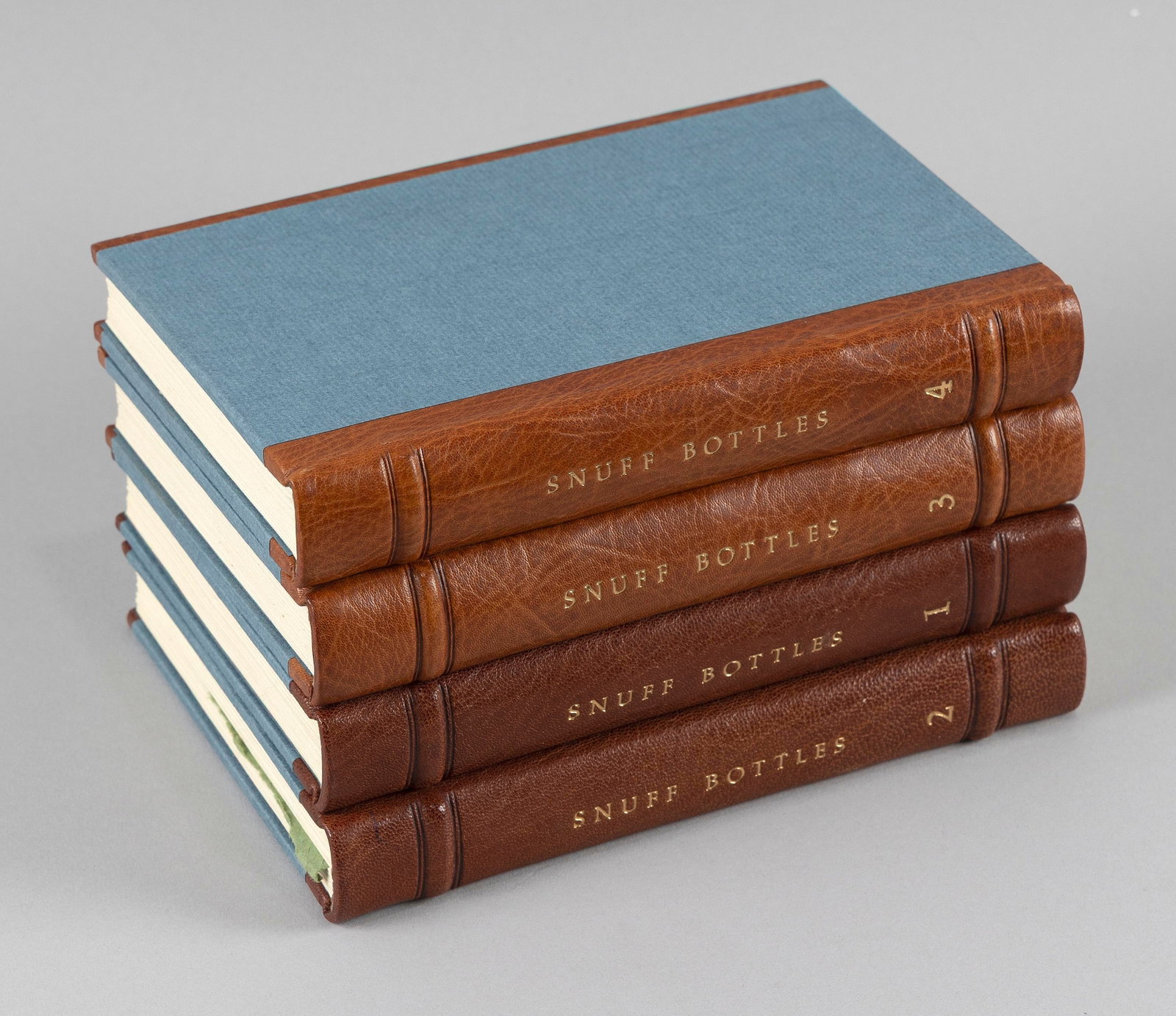 FOUR LEATHER-BOUND HANDWRITTEN JOURNALS ON SNUFF BOTTLES FROM THE ARNOLD COLLECTION (1 of 2)