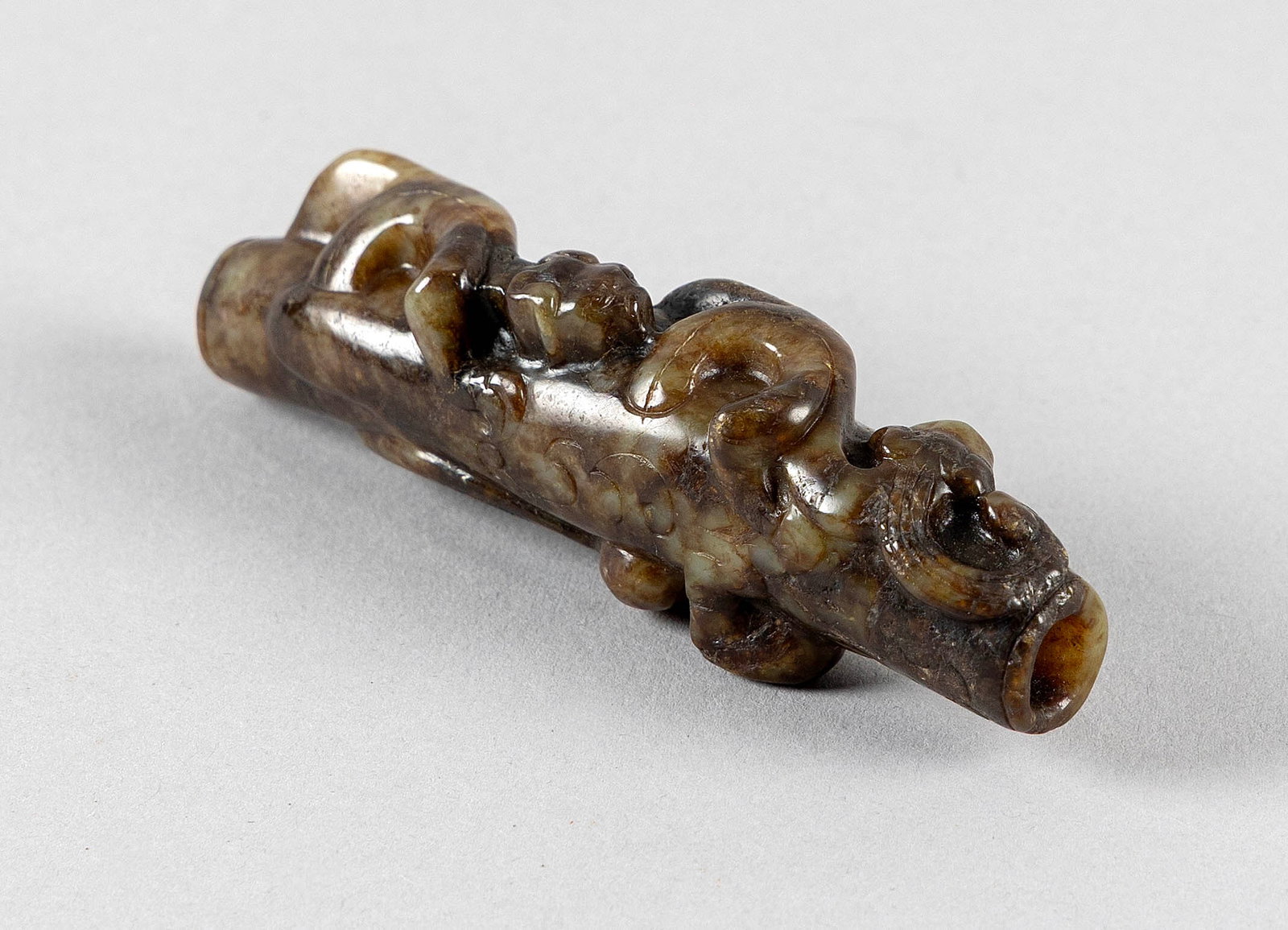 CHINESE MOTTLED GREEN JADE PENDANT Length 3.25".: CHINESE MOTTLED GREEN JADE PENDANT In the form of two kylin on a stalk of ruyi. Length 3.25".