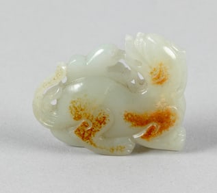 CHINESE CELADON/MUTTONFAT JADE CARVING OF A BIXI BEING ATTACKED BY A HAWK Late Ming Dynasty Length