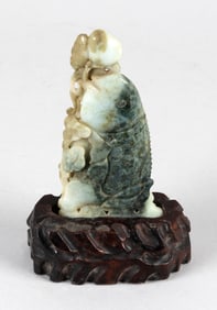 CHINESE CARVED MOTTLED GREEN JADE FISH 19th Century Jade length 5.5". Base height 2".