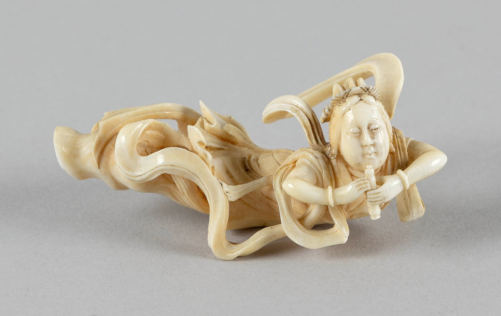 JAPANESE CARVED IVORY FIGURE OF BENZAITEN PLAYING A FLUTE Circa 1900 Length 3.5". (1 of 4)