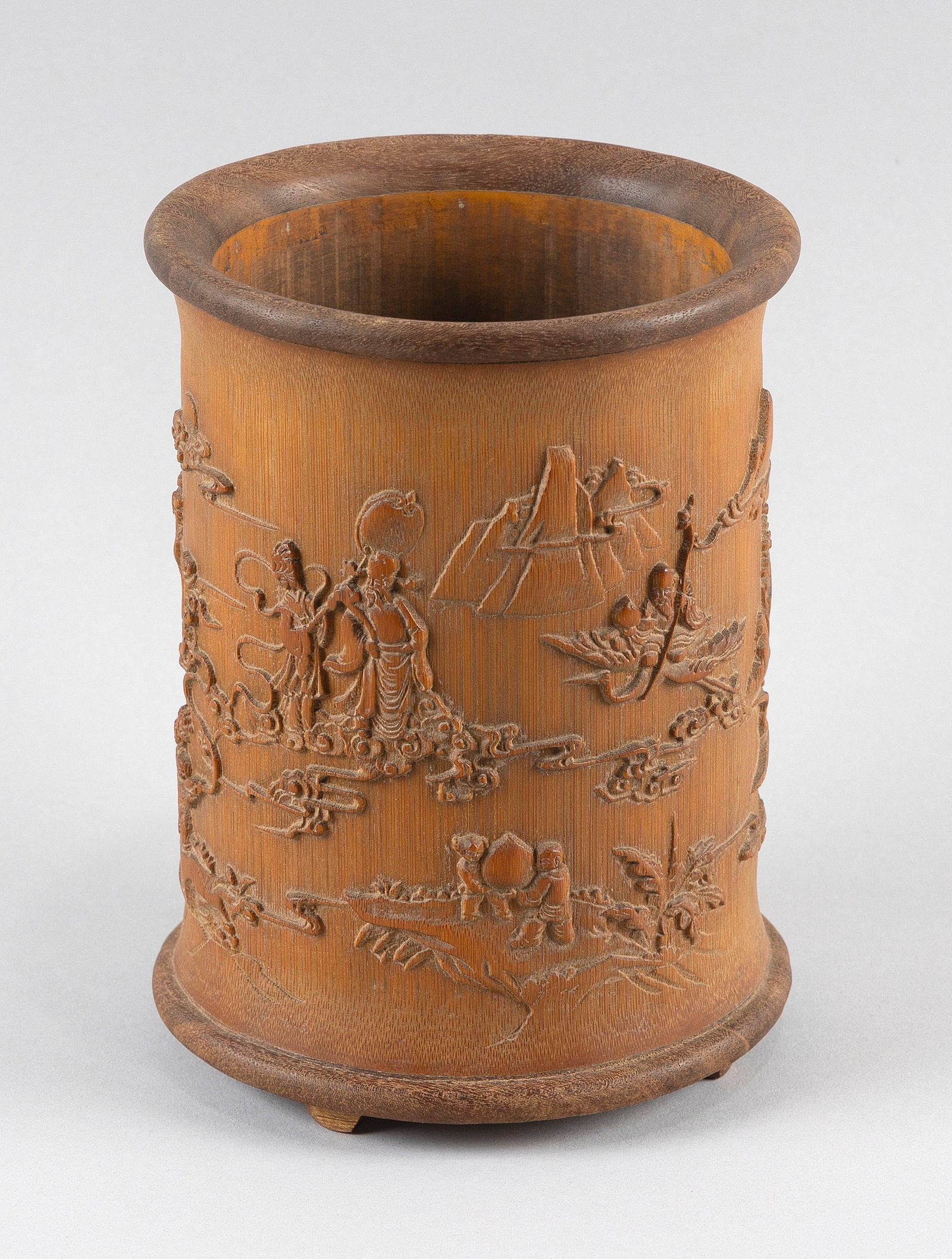 CHINESE CARVED BAMBOO BRUSH POT Early 20th Century Height 7.5".: CHINESE CARVED BAMBOO BRUSH POT Early 20th Century Wood rim and foot. Body with raised decoration of the Three Stars in a landscape. Dated "Autumn, 1929". Height 7.5".