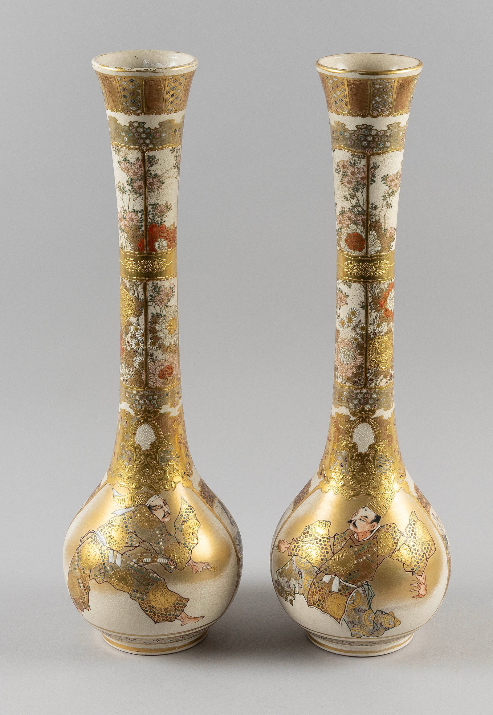 PAIR OF JAPANESE SATSUMA POTTERY VASES Meiji Period Heights 18".: PAIR OF JAPANESE SATSUMA POTTERY VASES Meiji Period Pear-shaped with elongated necks and trumpet mouths. Bodies decorated with Samurai figures in vignettes surrounded by sepia landscapes and gilt broc