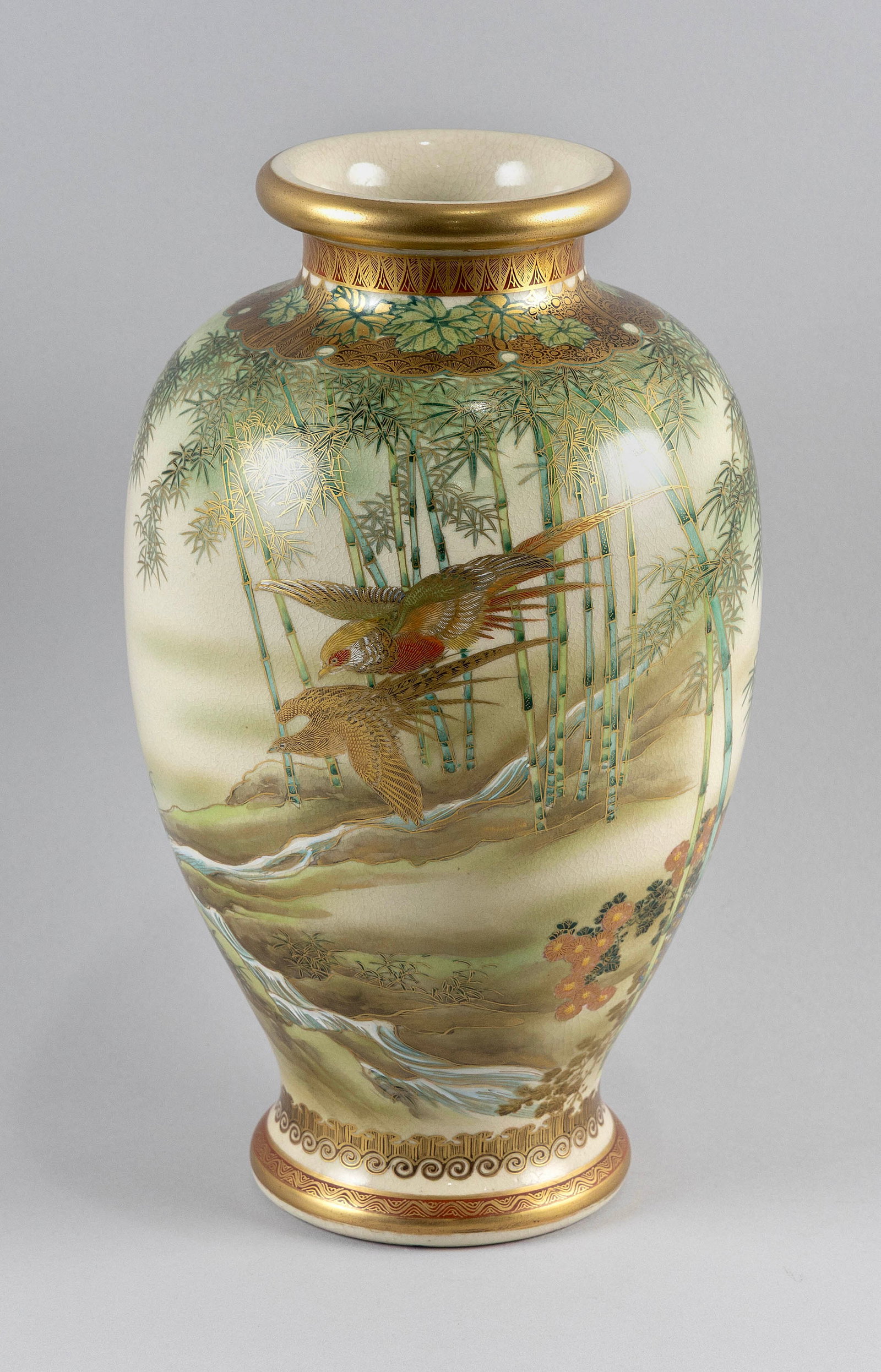 JAPANESE SATSUMA PORCELAIN VASE Height 13".: JAPANESE SATSUMA PORCELAIN VASE Finely painted decoration of birds flying through a bamboo-filled landscape with waterfall and chrysanthemums. Signed "Ryaozan" on base. Height 13".